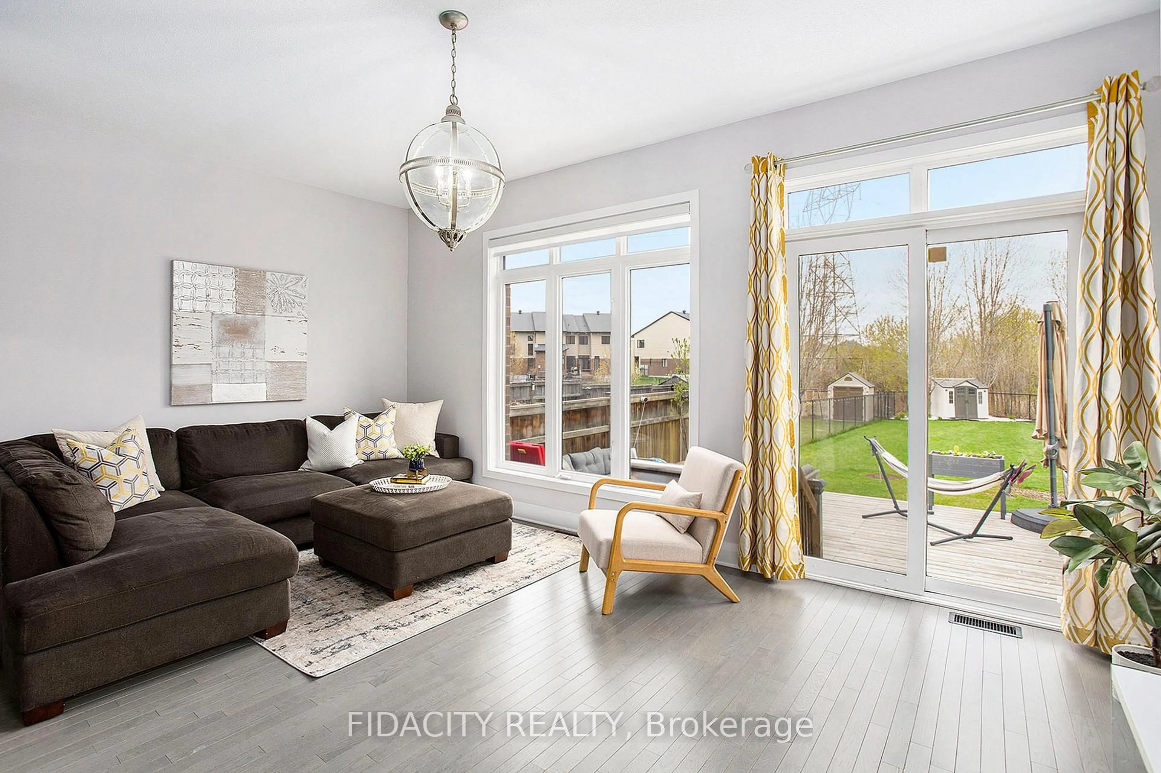 Living room with furniture, wood/laminate floor for 670 Whitecliffs Ave, Ottawa Ontario K1V 2N4