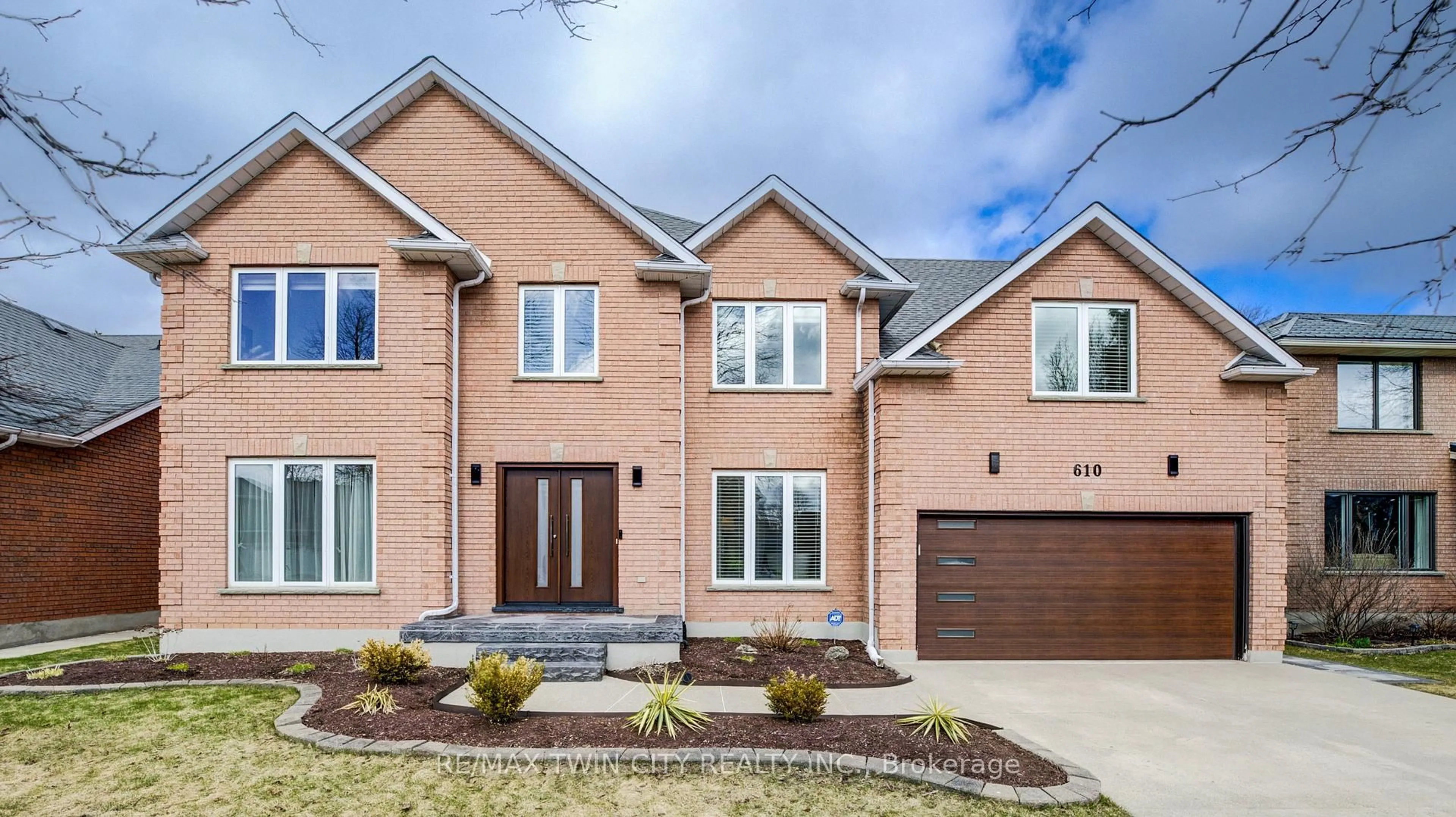 Home with brick exterior material, street for 610 STONEBURY Cres, Waterloo Ontario N2K 3R1