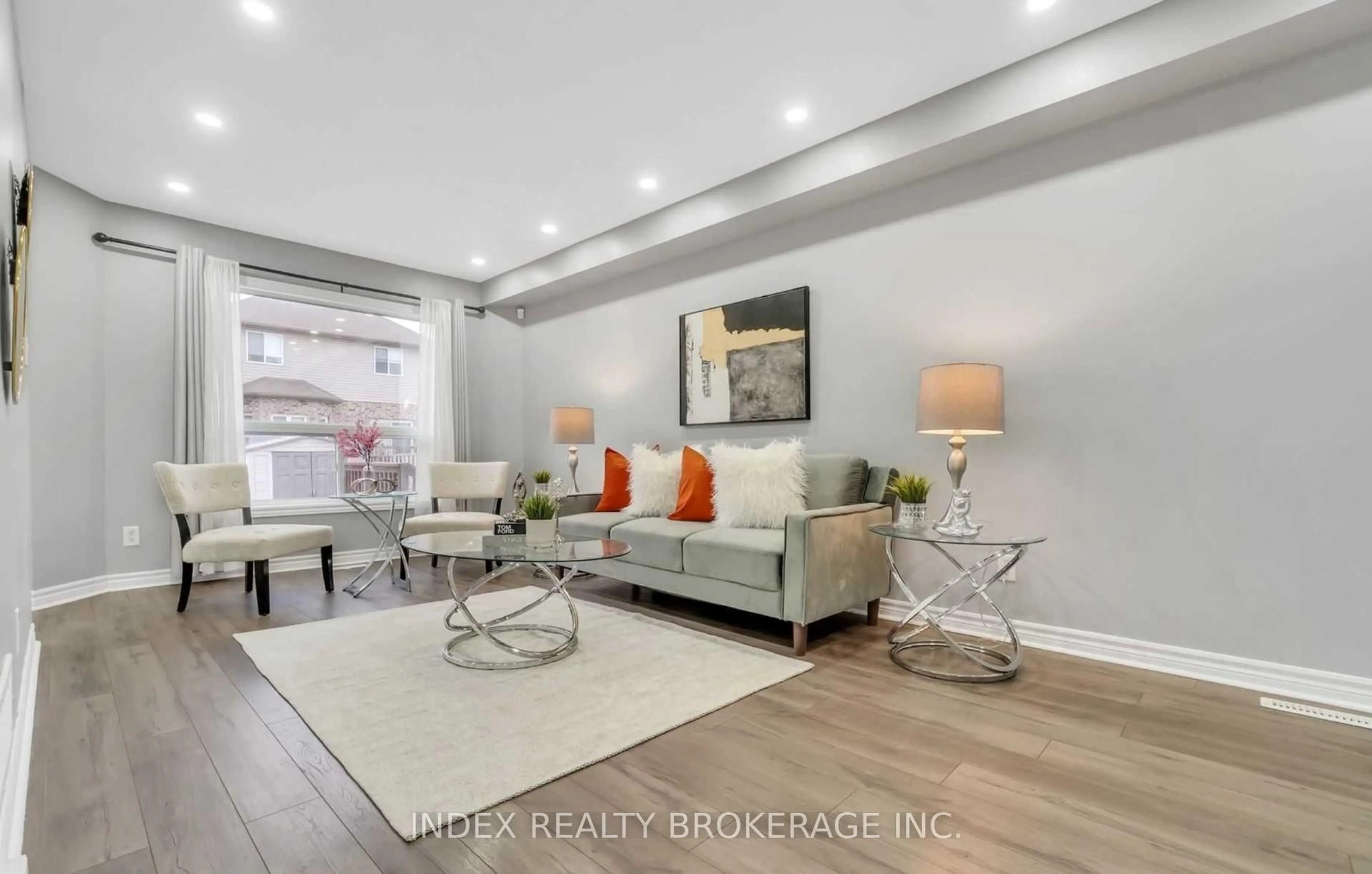 Living room with furniture, wood/laminate floor for 3389 Georgeheriot Lane, London South Ontario N6L 0A5