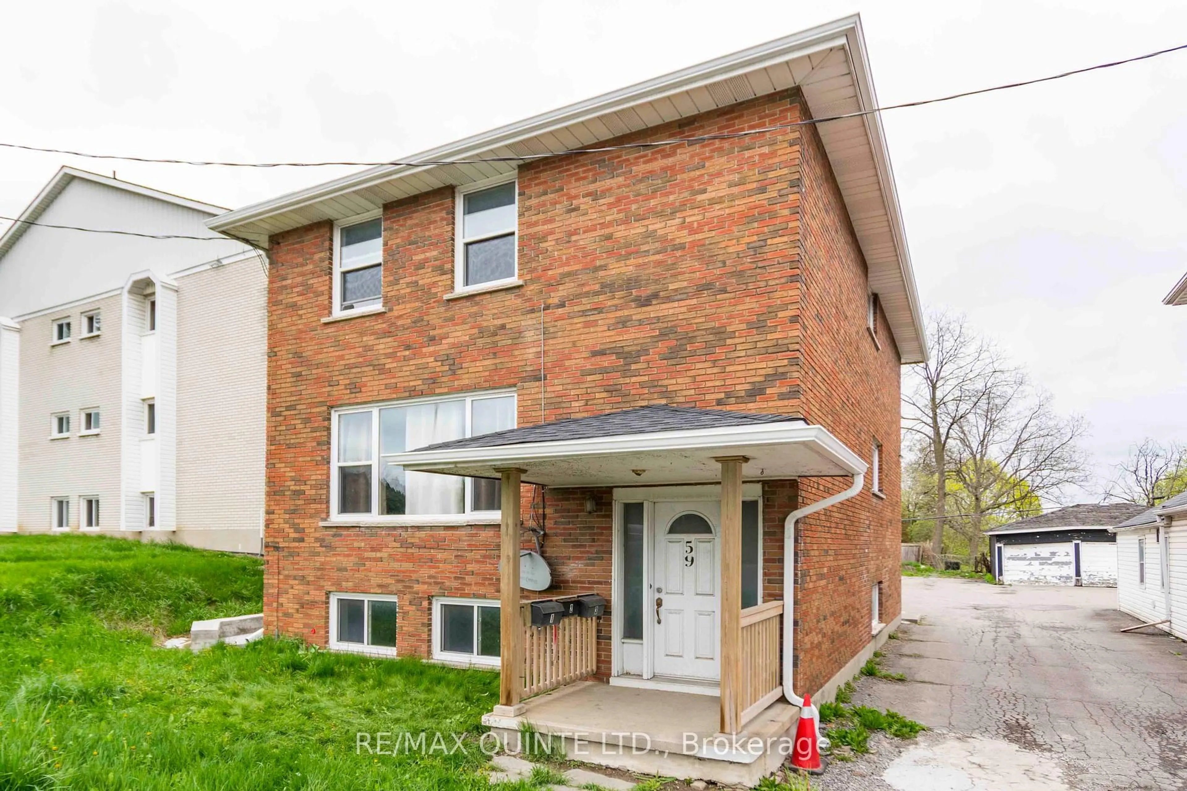 Home with brick exterior material, street for 59 North Front St, Belleville Ontario K8P 3B2