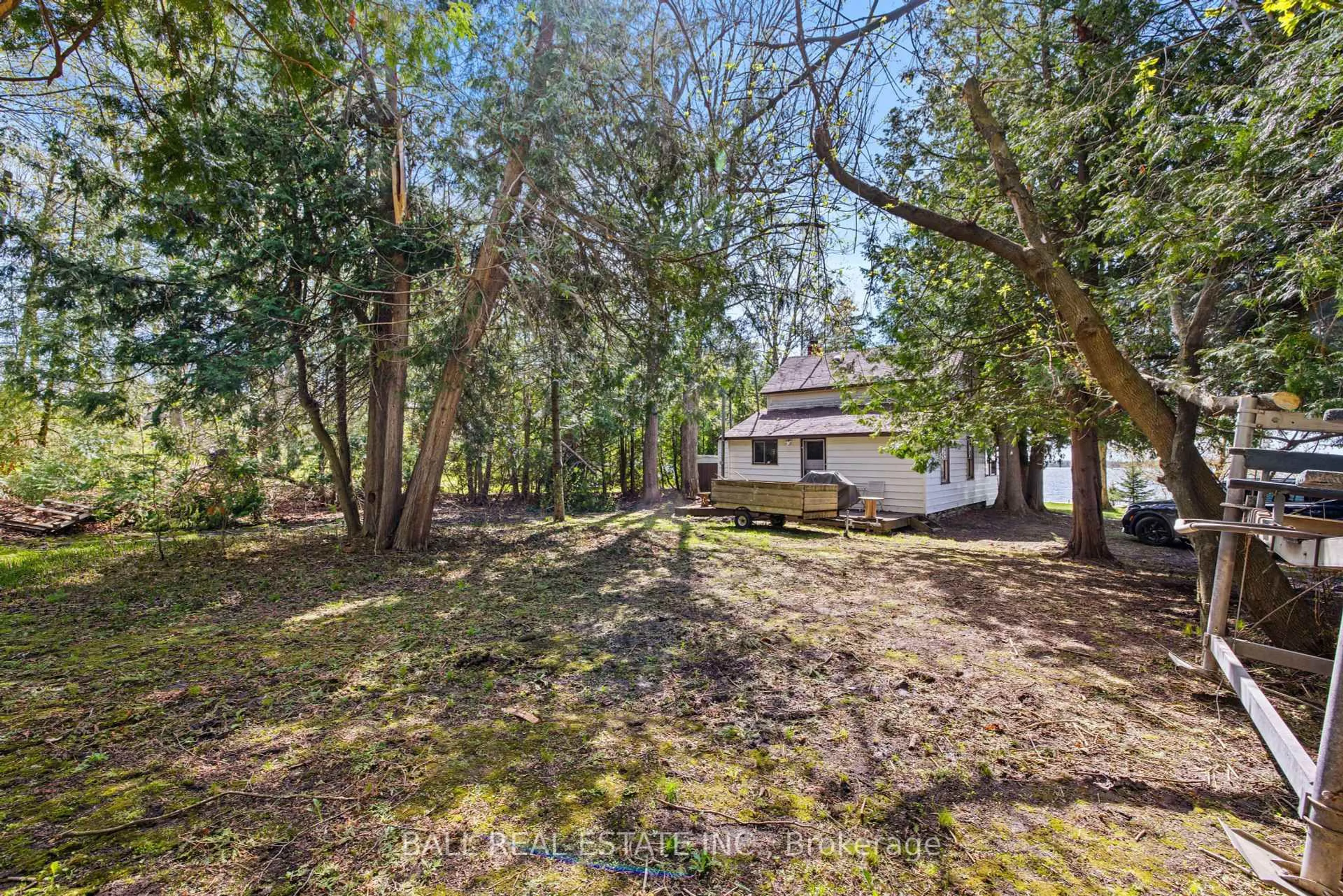 A pic from outside/outdoor area/front of a property/back of a property/a pic from drone, forest/trees view for 53 Rustic Bay St, Kawartha Lakes Ontario K9V 4R6