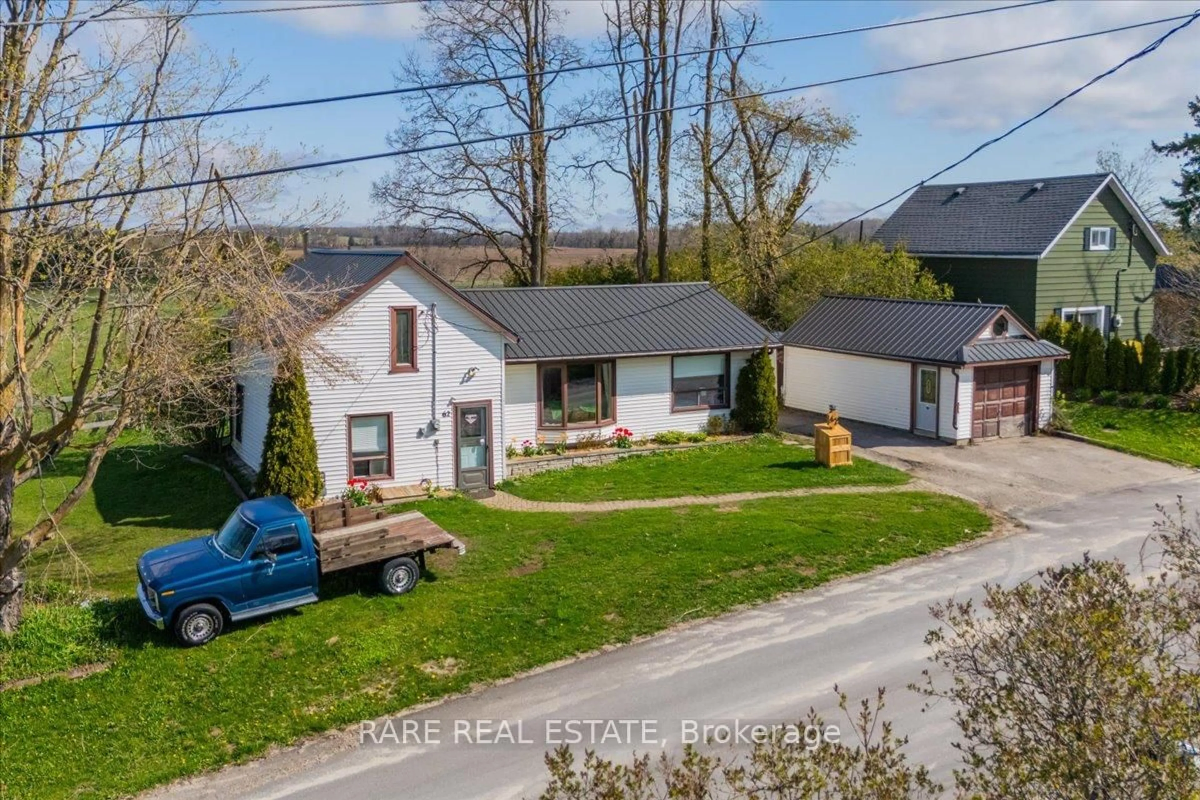 A pic from outside/outdoor area/front of a property/back of a property/a pic from drone, street for 62 MILL Lane, Melancthon Ontario L9V 2T9