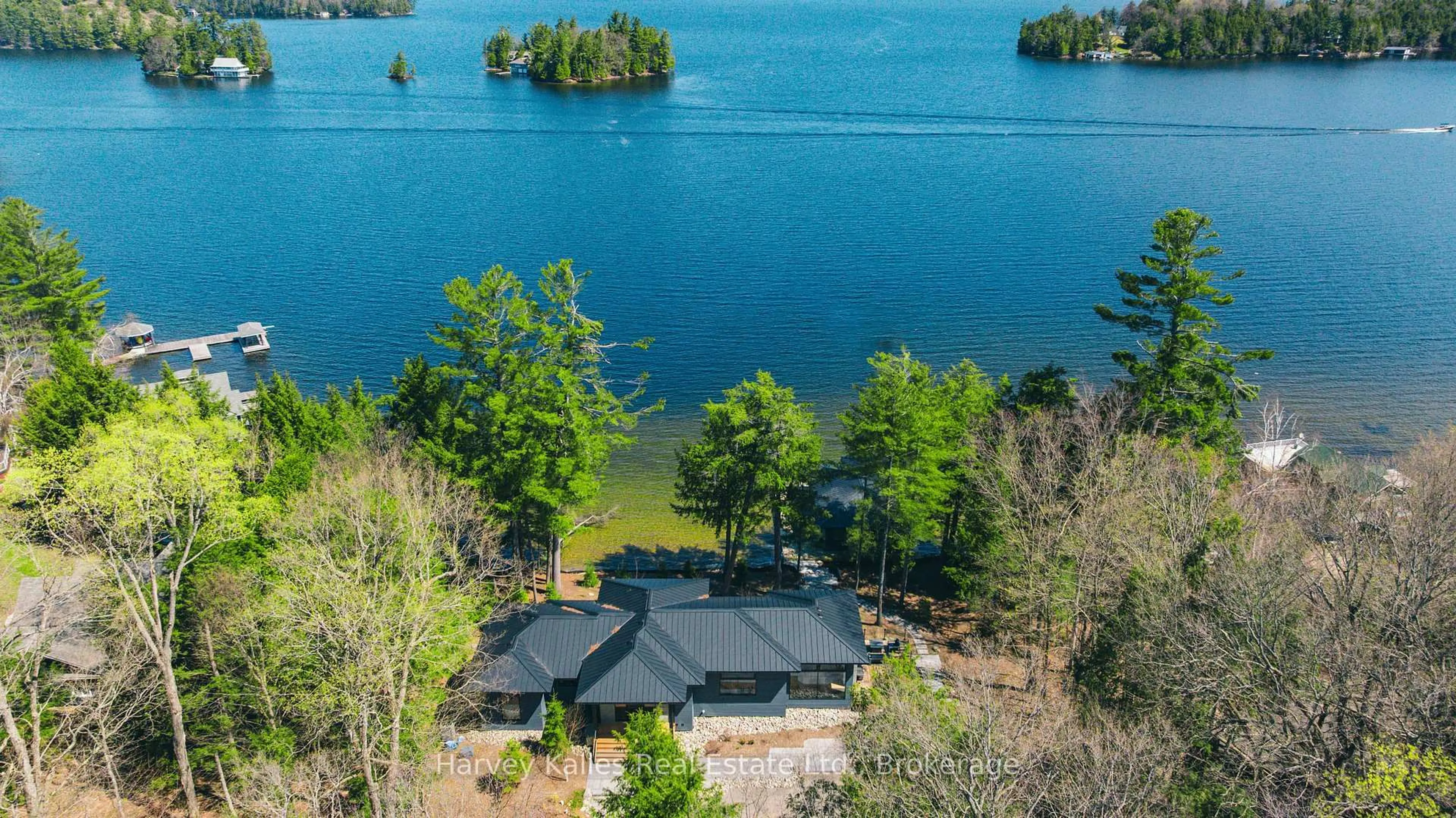 A pic from outside/outdoor area/front of a property/back of a property/a pic from drone, water/lake/river/ocean view for 1114 Shamrock Rd #5, Muskoka Lakes Ontario P0B 1J0