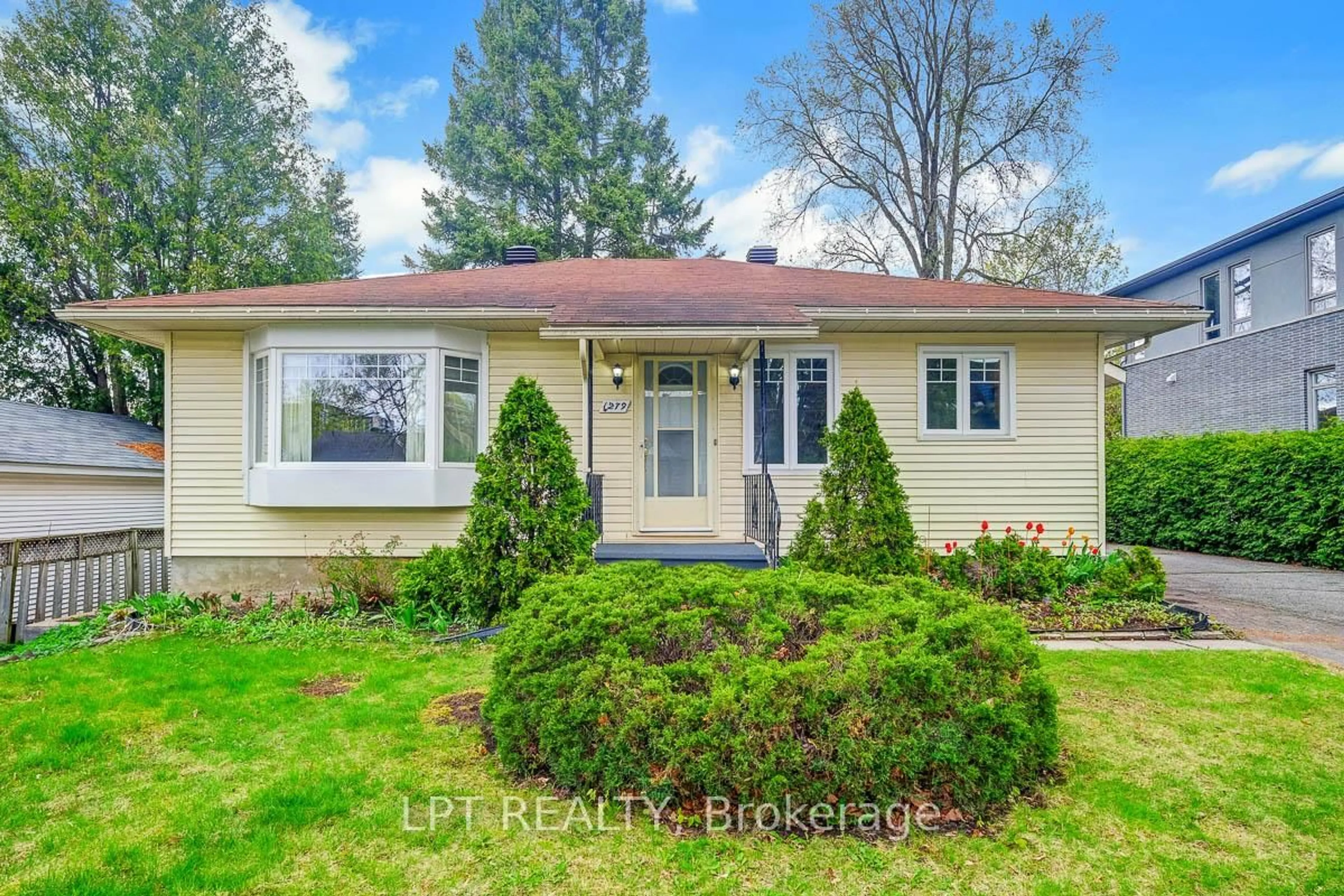 Home with vinyl exterior material, street for 1279 Livingstone Ave, Ottawa Ontario K1H 7P7