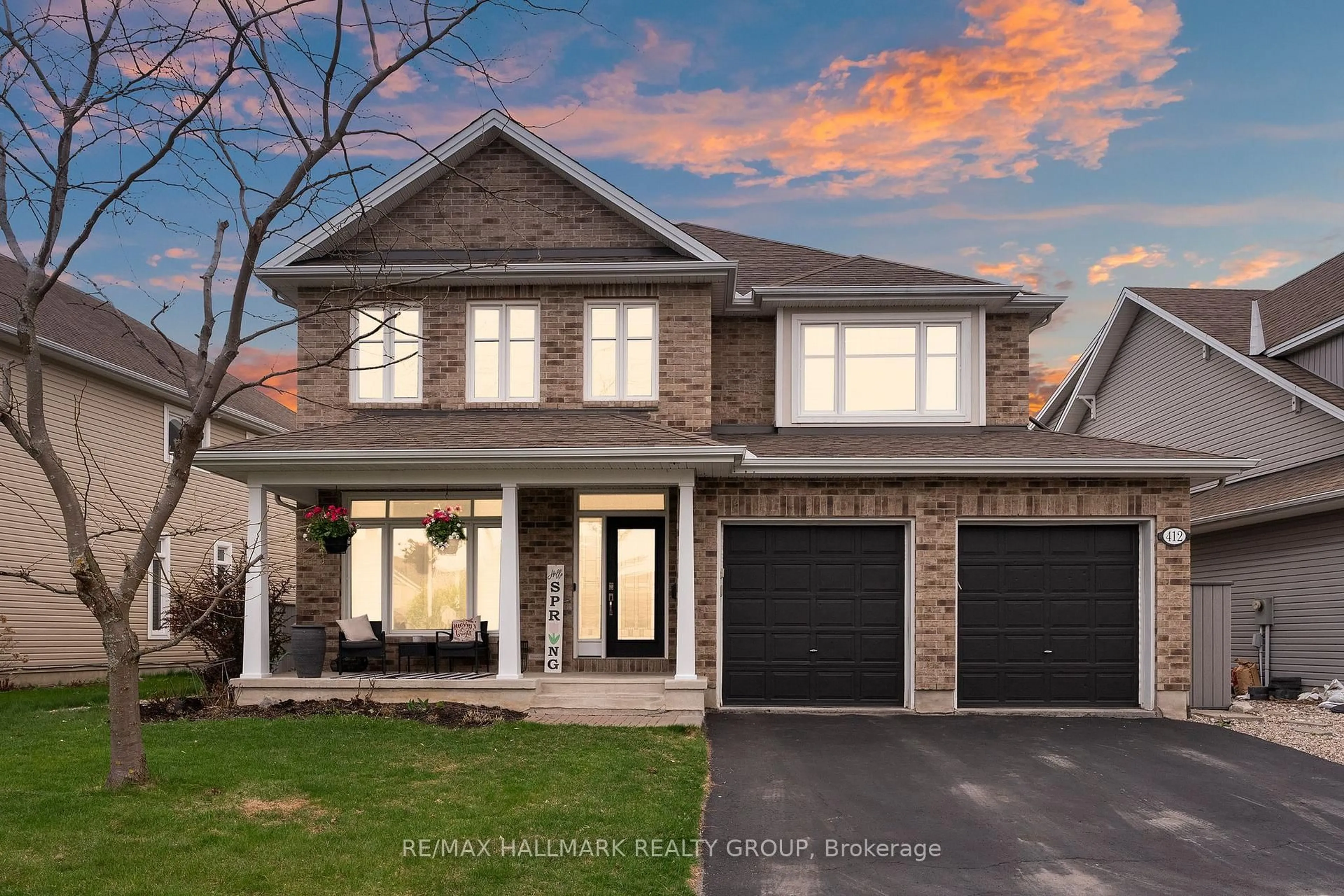 Home with brick exterior material, street for 412 Callisto Way, Ottawa Ontario K2J 0Z3