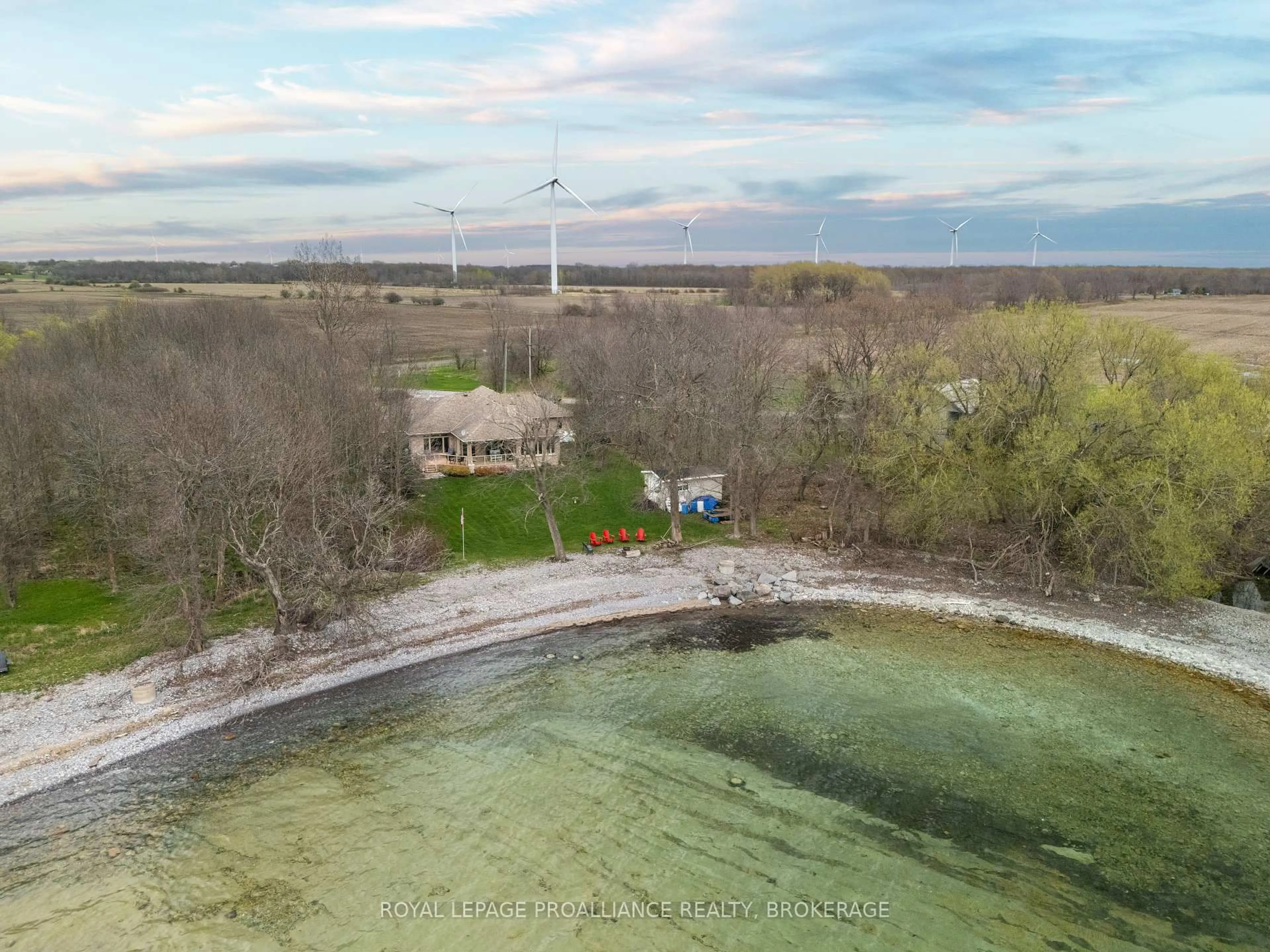 A pic from outside/outdoor area/front of a property/back of a property/a pic from drone, water/lake/river/ocean view for 12 Easy Lane, Wolfe Island Ontario K0H 2Y0
