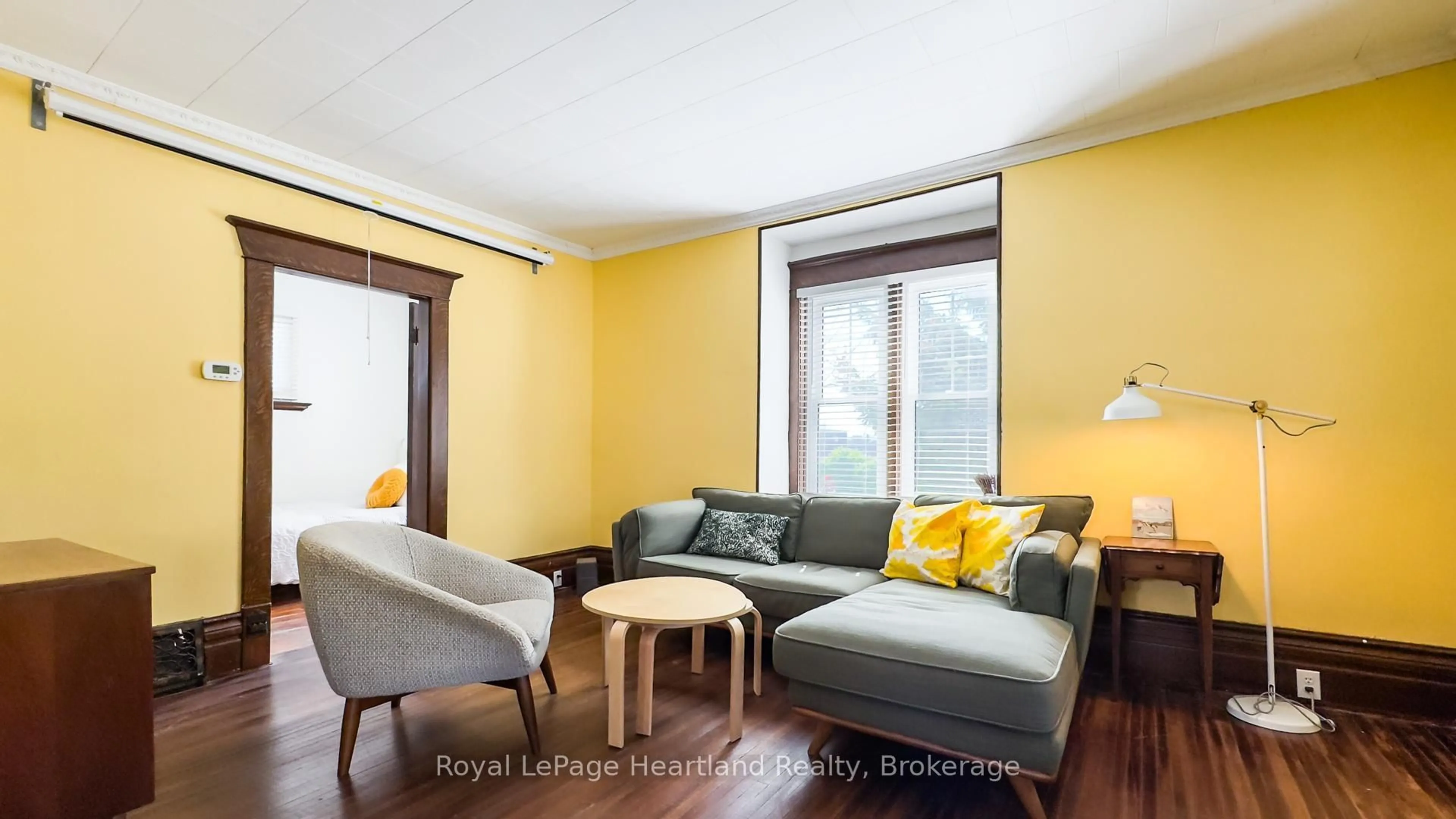 Living room with furniture, wood/laminate floor for 47 James St, South Huron Ontario N0M 1S1