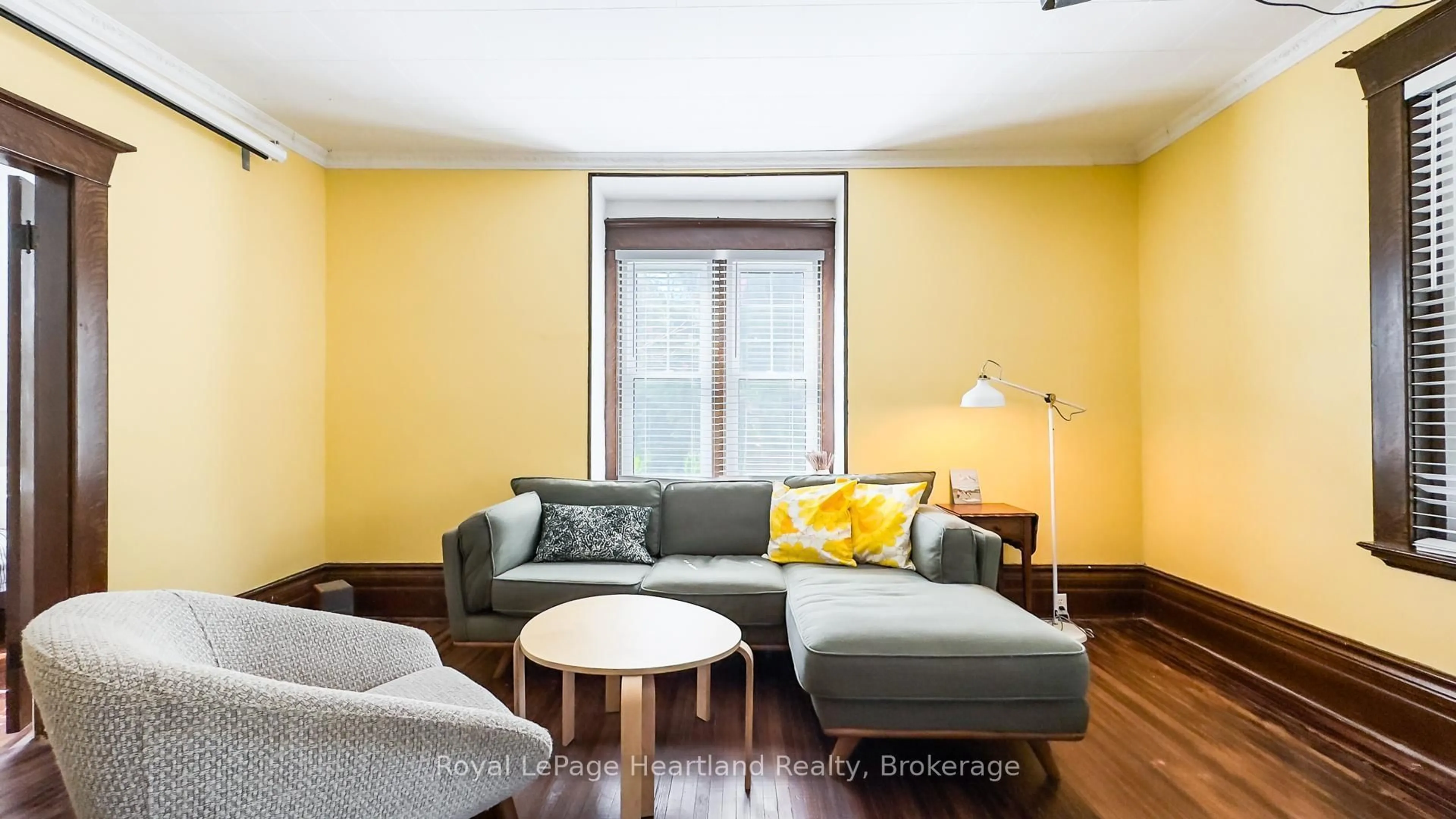 Living room with furniture, wood/laminate floor for 47 James St, South Huron Ontario N0M 1S1