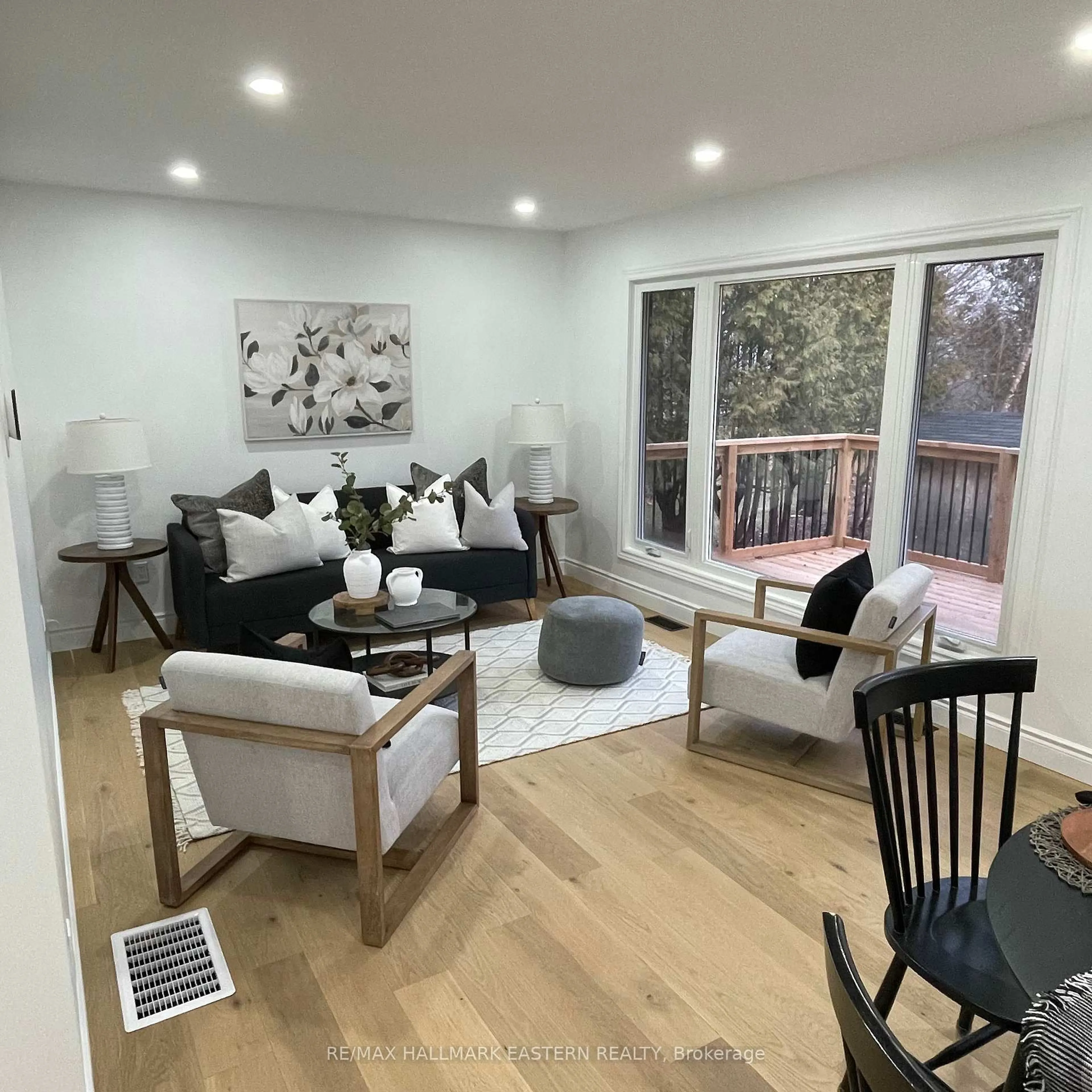 Living room with furniture, wood/laminate floor for 248 Crosby Dr, Kawartha Lakes Ontario K0M 1A0