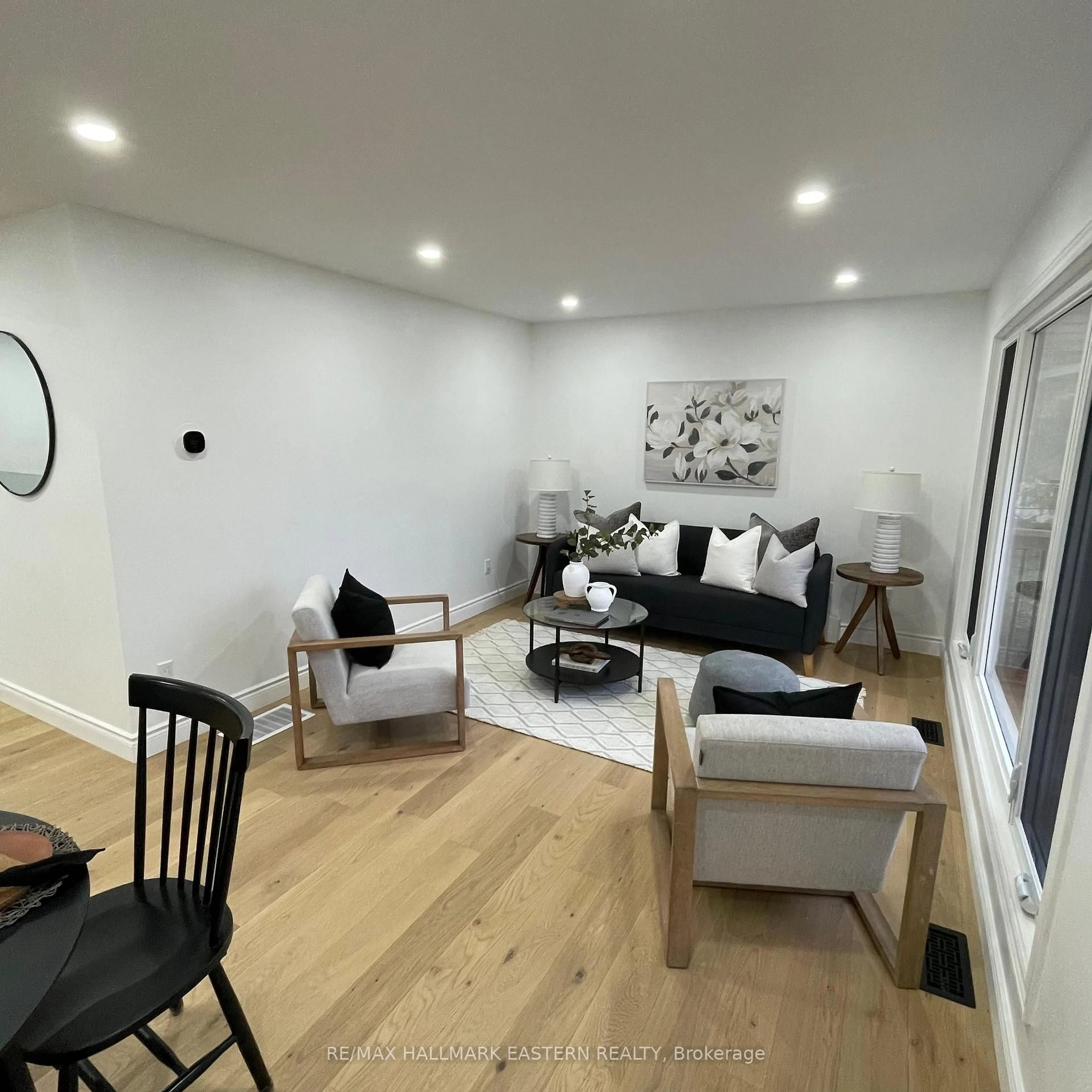 Living room with furniture, wood/laminate floor for 248 Crosby Dr, Kawartha Lakes Ontario K0M 1A0