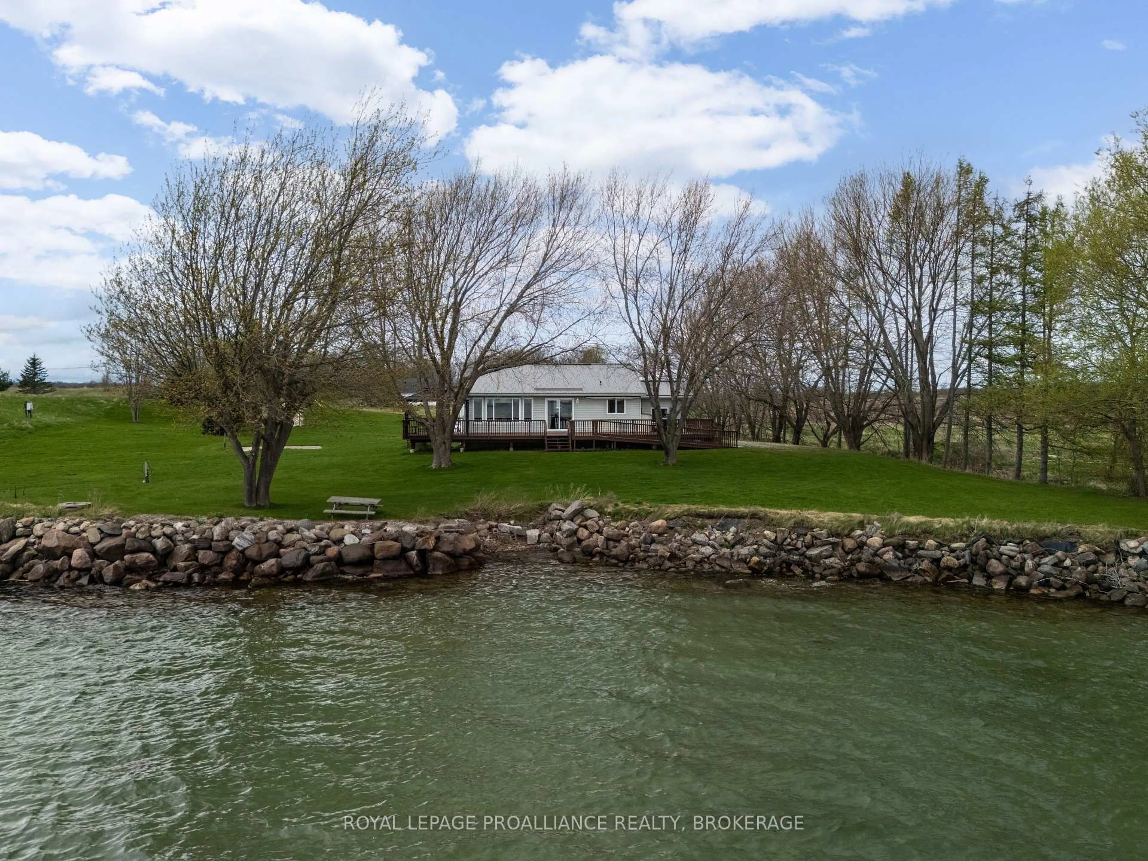 A pic from outside/outdoor area/front of a property/back of a property/a pic from drone, water/lake/river/ocean view for 4205 Highway 96 N/A, Wolfe Island Ontario K0H 2Y0