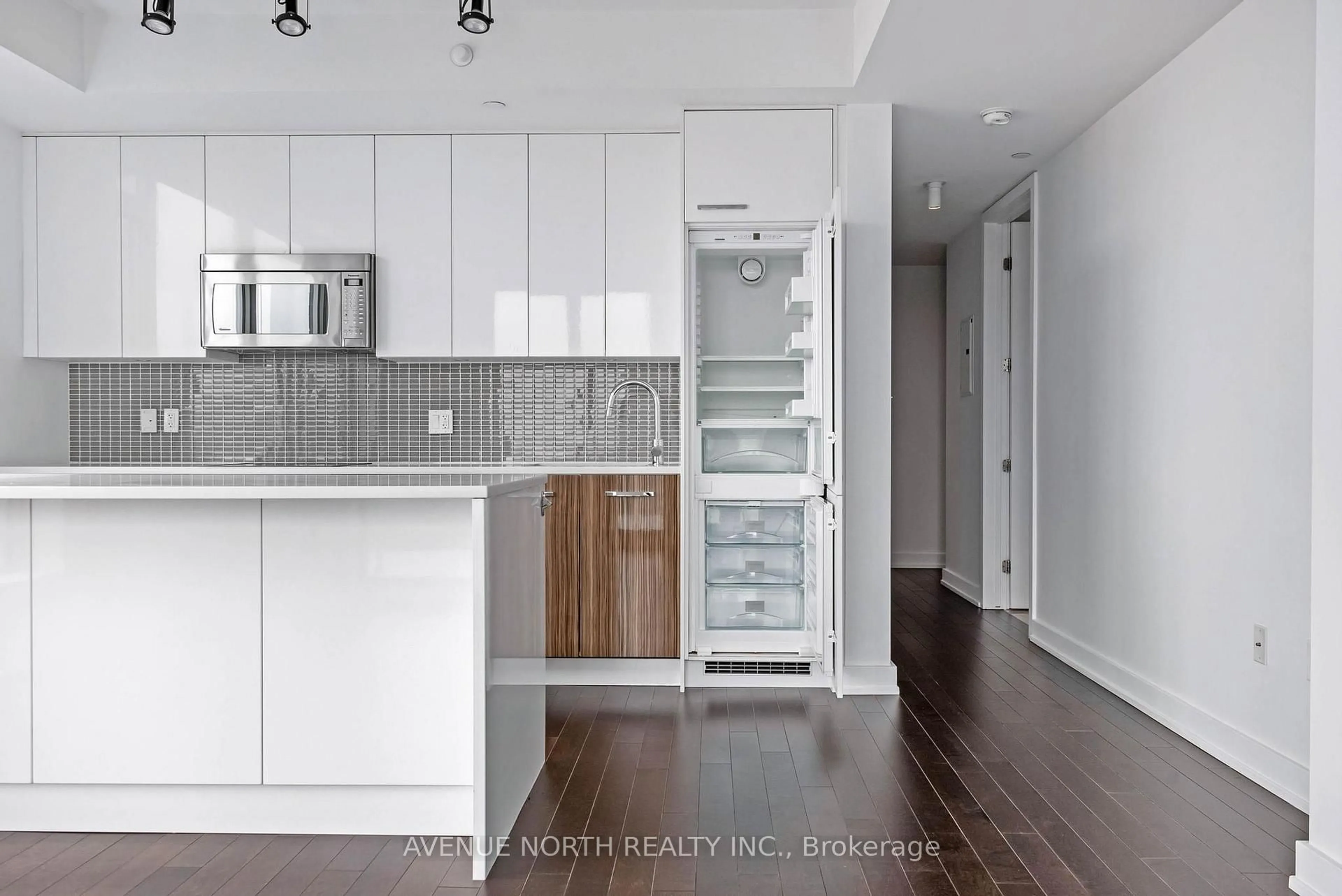 Open concept kitchen, wood/laminate floor for 111 Champagne Ave #509, Ottawa Ontario K1S 5V3