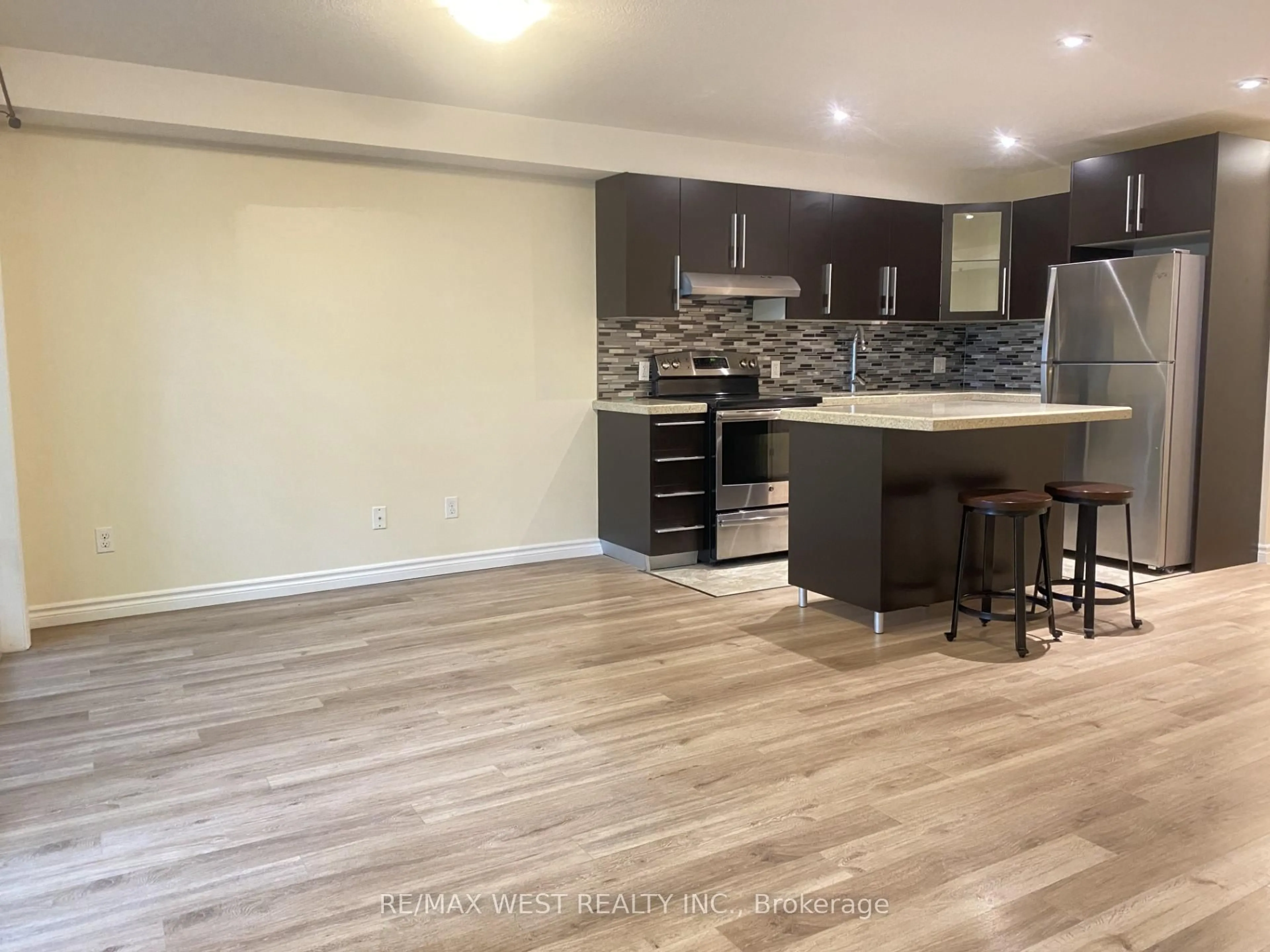 Open concept kitchen, wood/laminate floor for 85 Gage Ave #2, Kitchener Ontario N2G 0B4