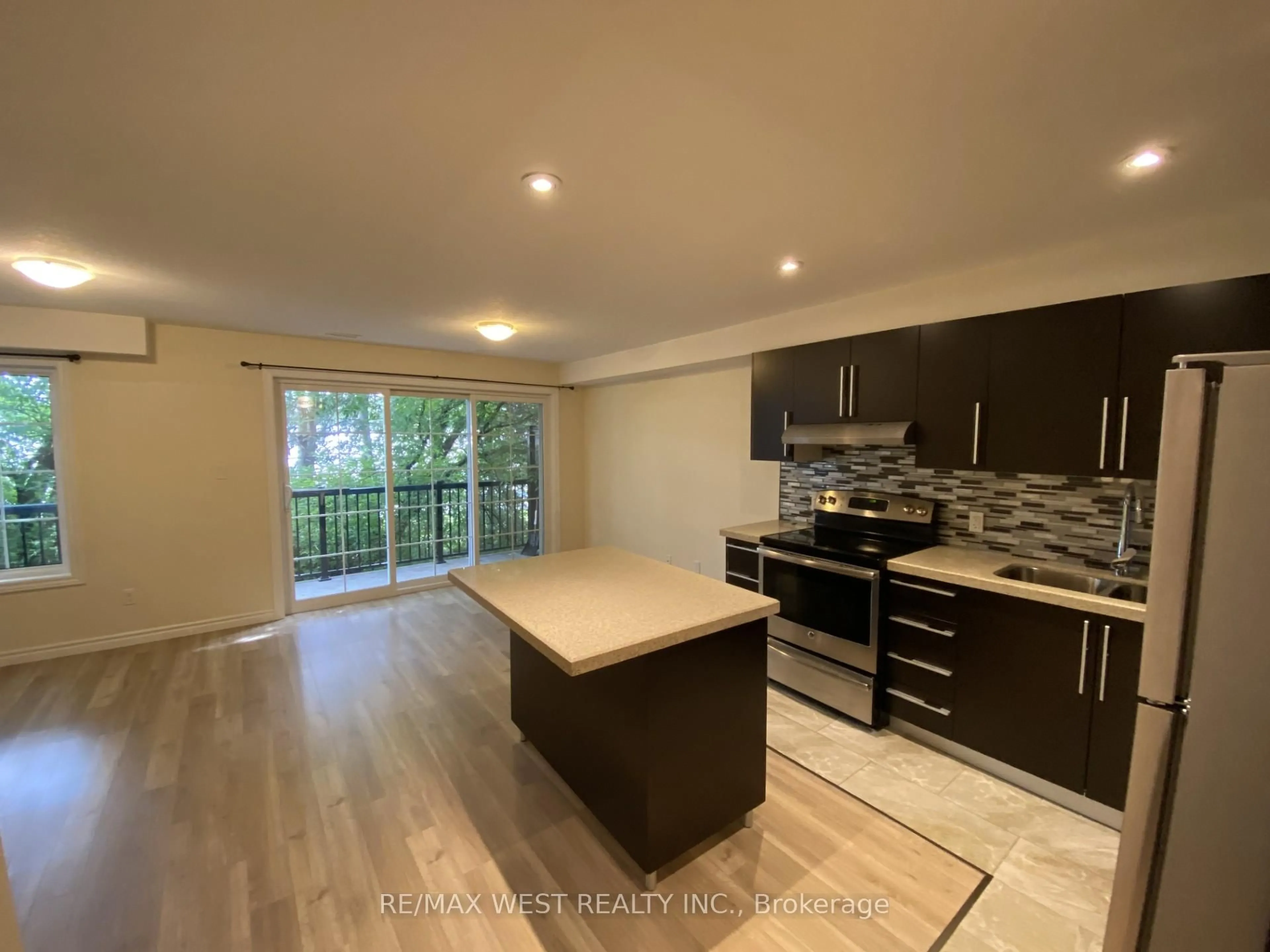 Open concept kitchen, wood/laminate floor for 85 Gage Ave #2, Kitchener Ontario N2G 0B4