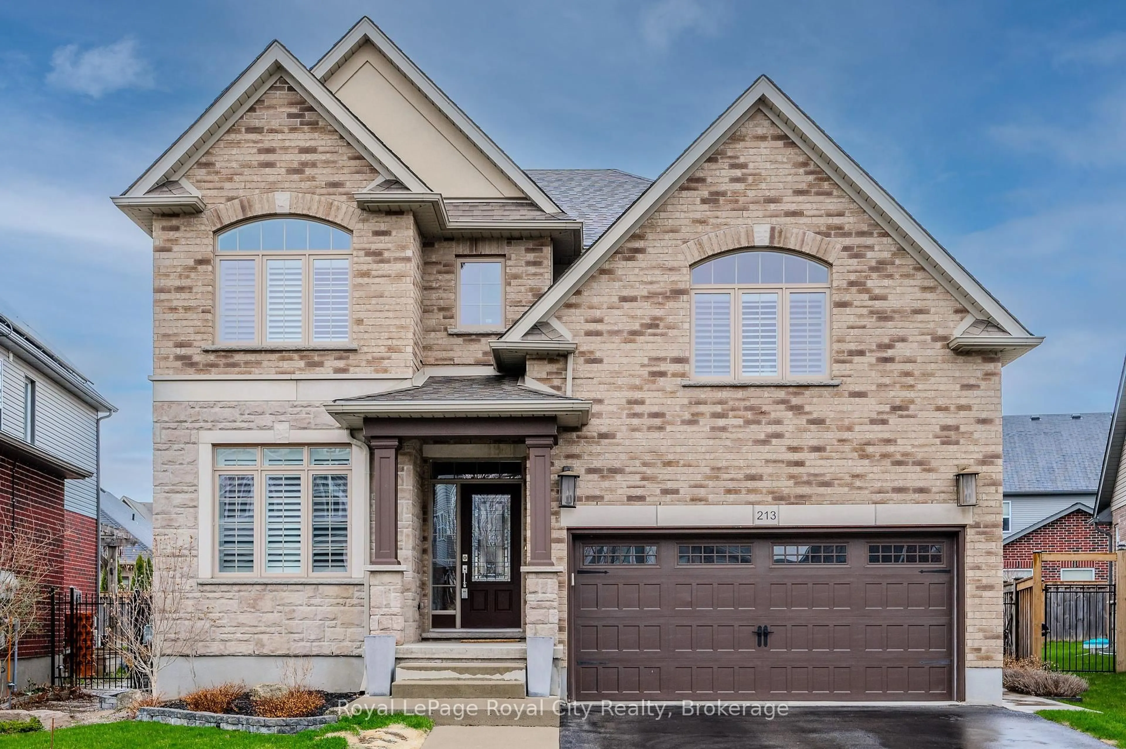 Home with brick exterior material, street for 213 Tremaine Cres, Kitchener Ontario N2A 4L9