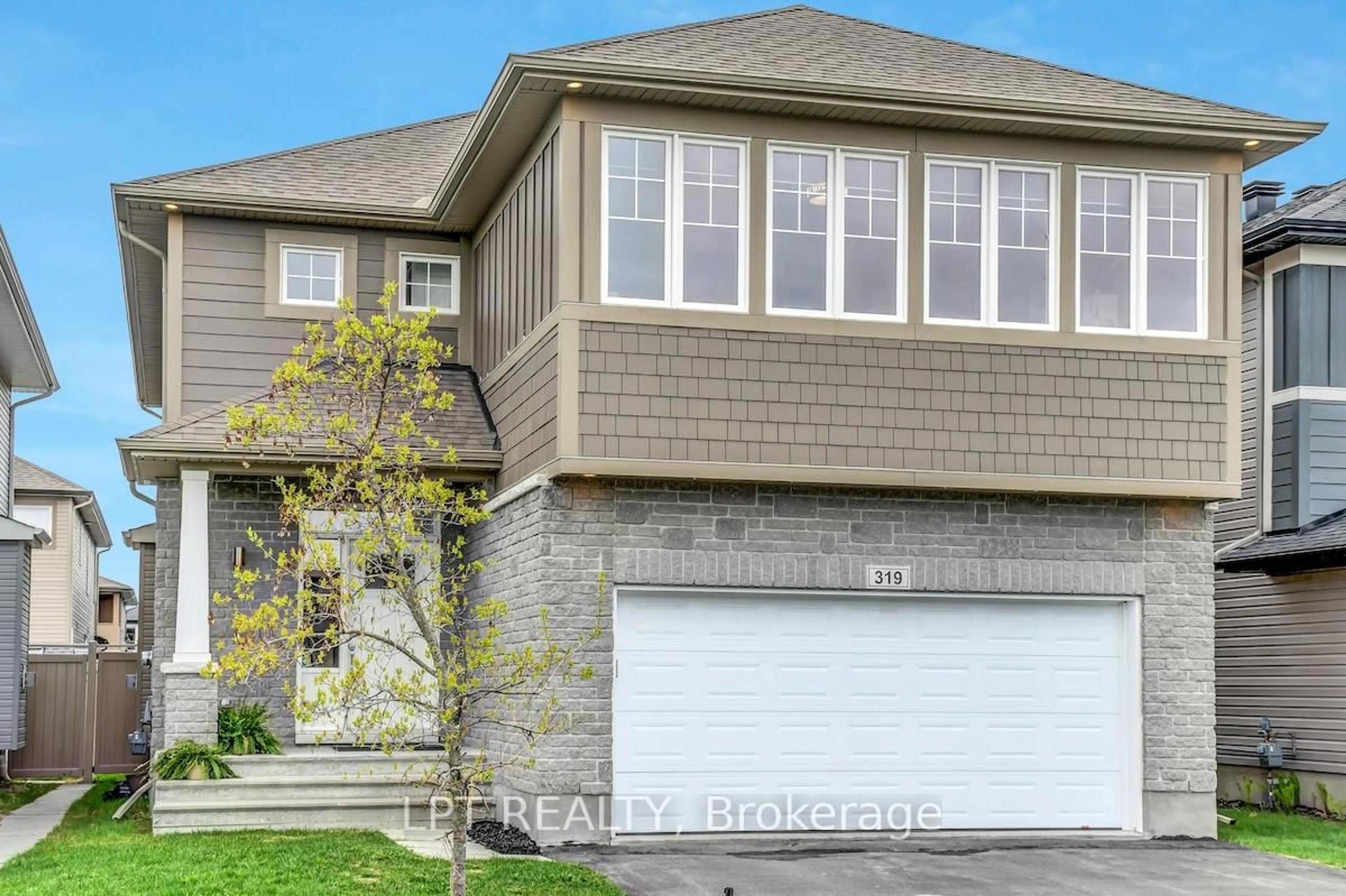 Home with vinyl exterior material, street for 319 Oxer Pl, Ottawa Ontario K2V 0C6
