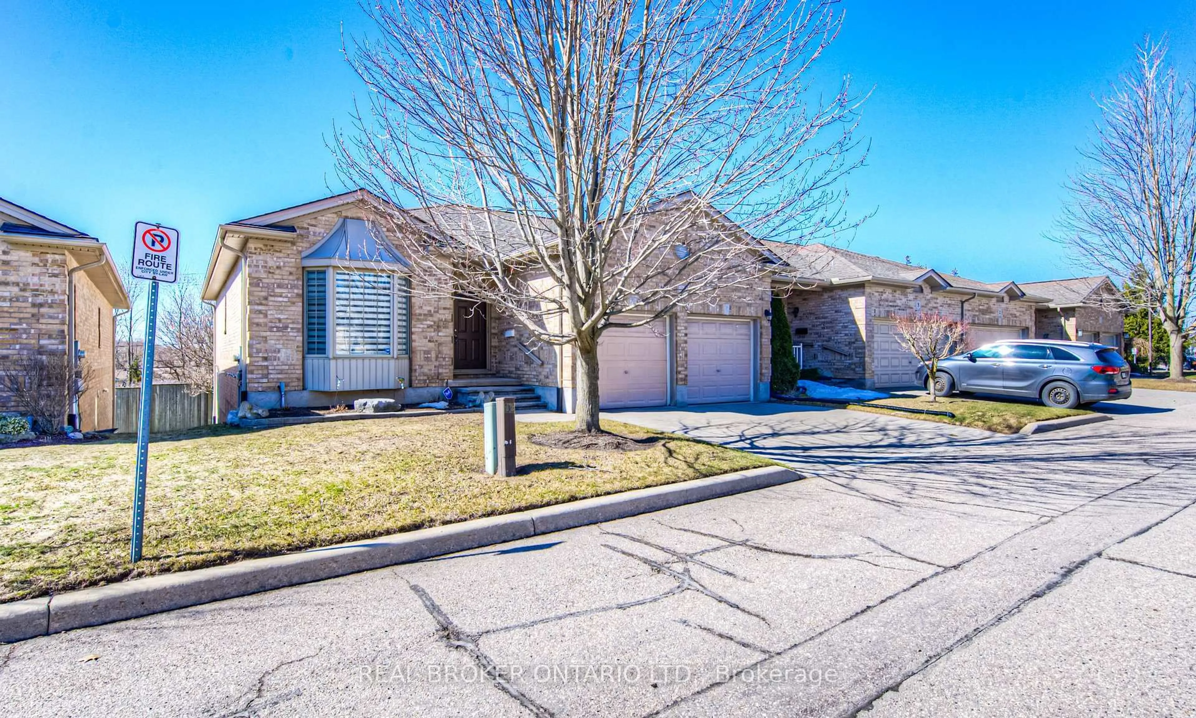 A pic from outside/outdoor area/front of a property/back of a property/a pic from drone, street for 900 Doon Village Rd #4, Kitchener Ontario N2P 1A4