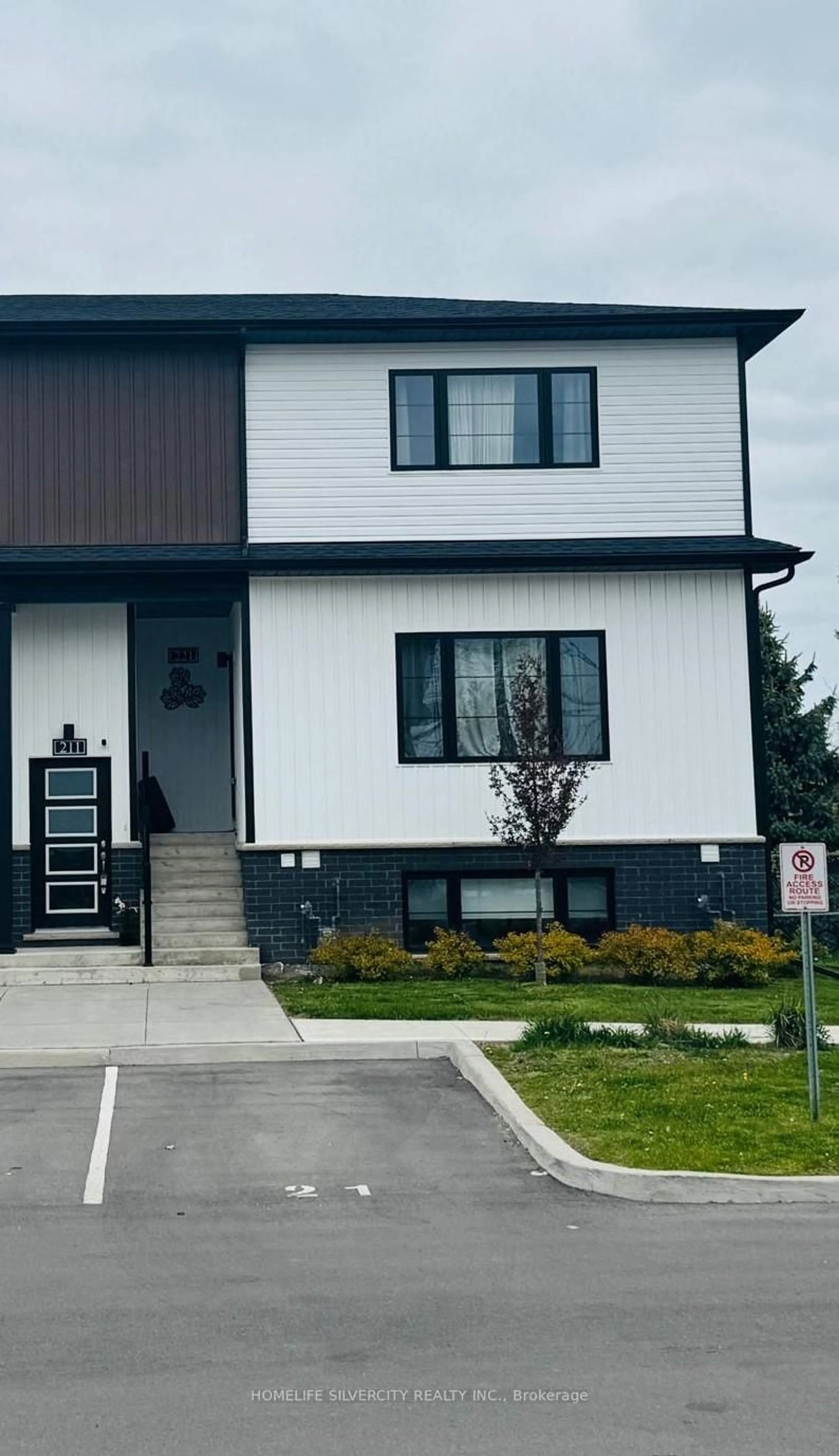 Home with vinyl exterior material, street for 4263 Fourth Ave #211, Niagara Falls Ontario L2E 0C2