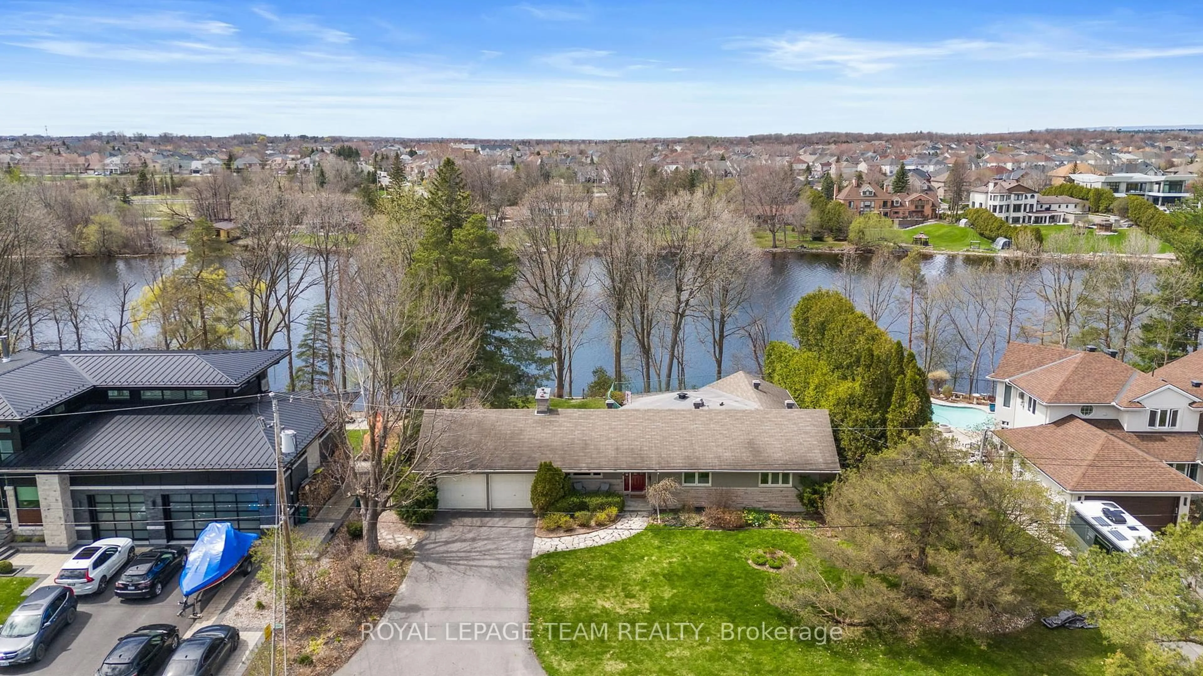 A pic from outside/outdoor area/front of a property/back of a property/a pic from drone, water/lake/river/ocean view for 56 Ryeburn Dr, Ottawa Ontario K1V 1H5