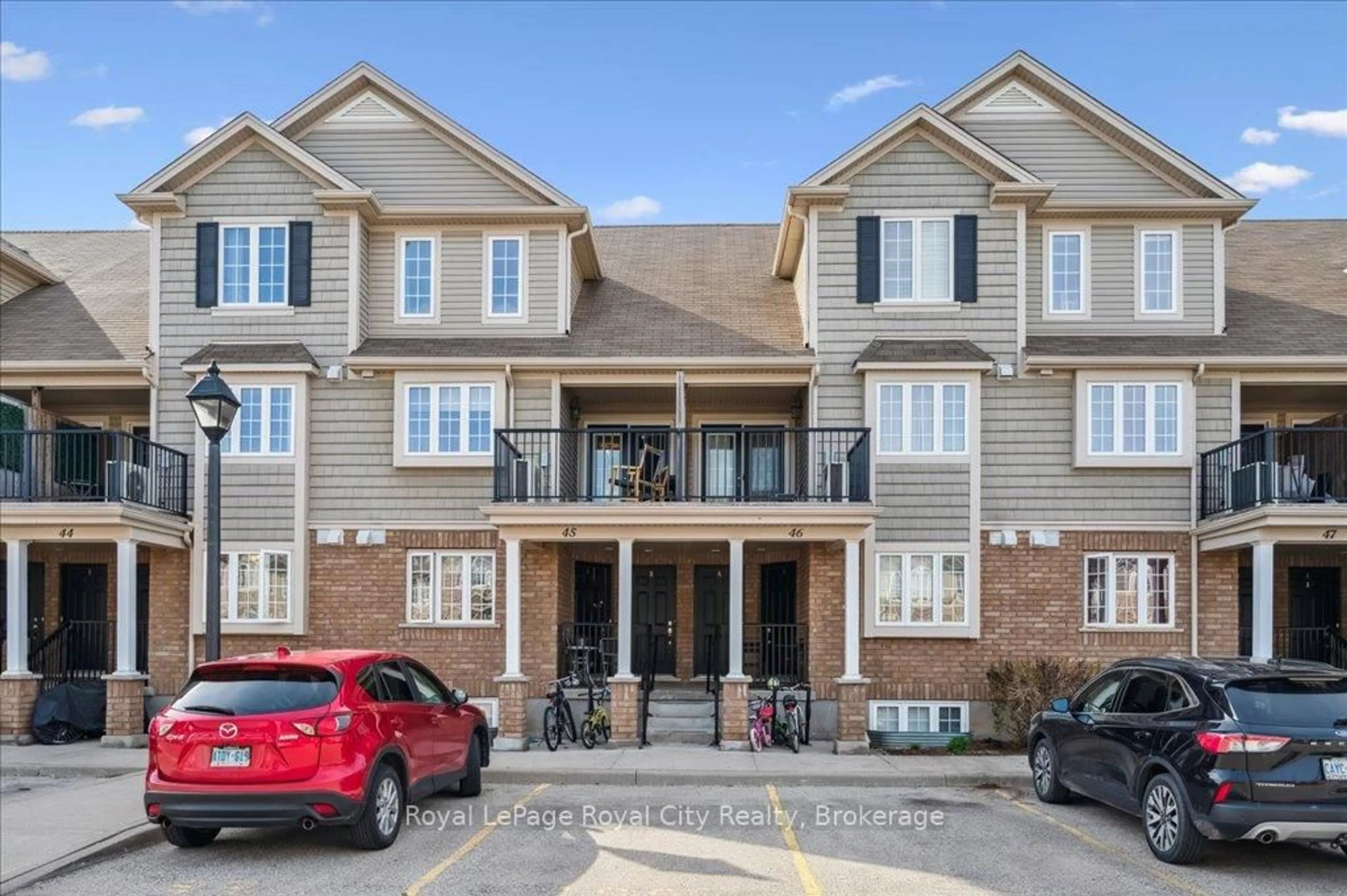 A pic from outside/outdoor area/front of a property/back of a property/a pic from drone, street for 15 Carere Cres #45B, Guelph Ontario N1E 0K4