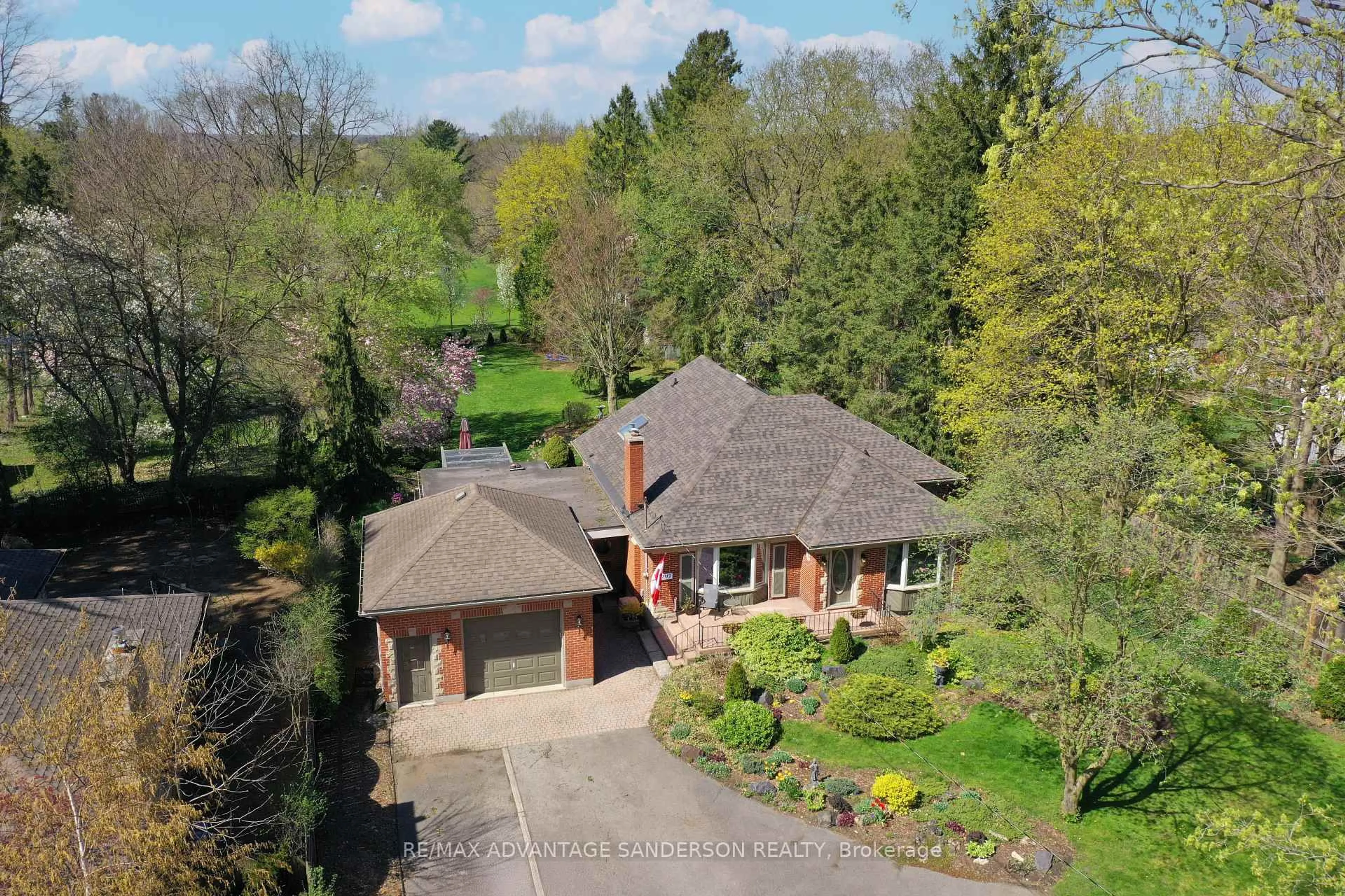 A pic from outside/outdoor area/front of a property/back of a property/a pic from drone, street for 1313 Byron Baseline Rd, London South Ontario N6K 2E4