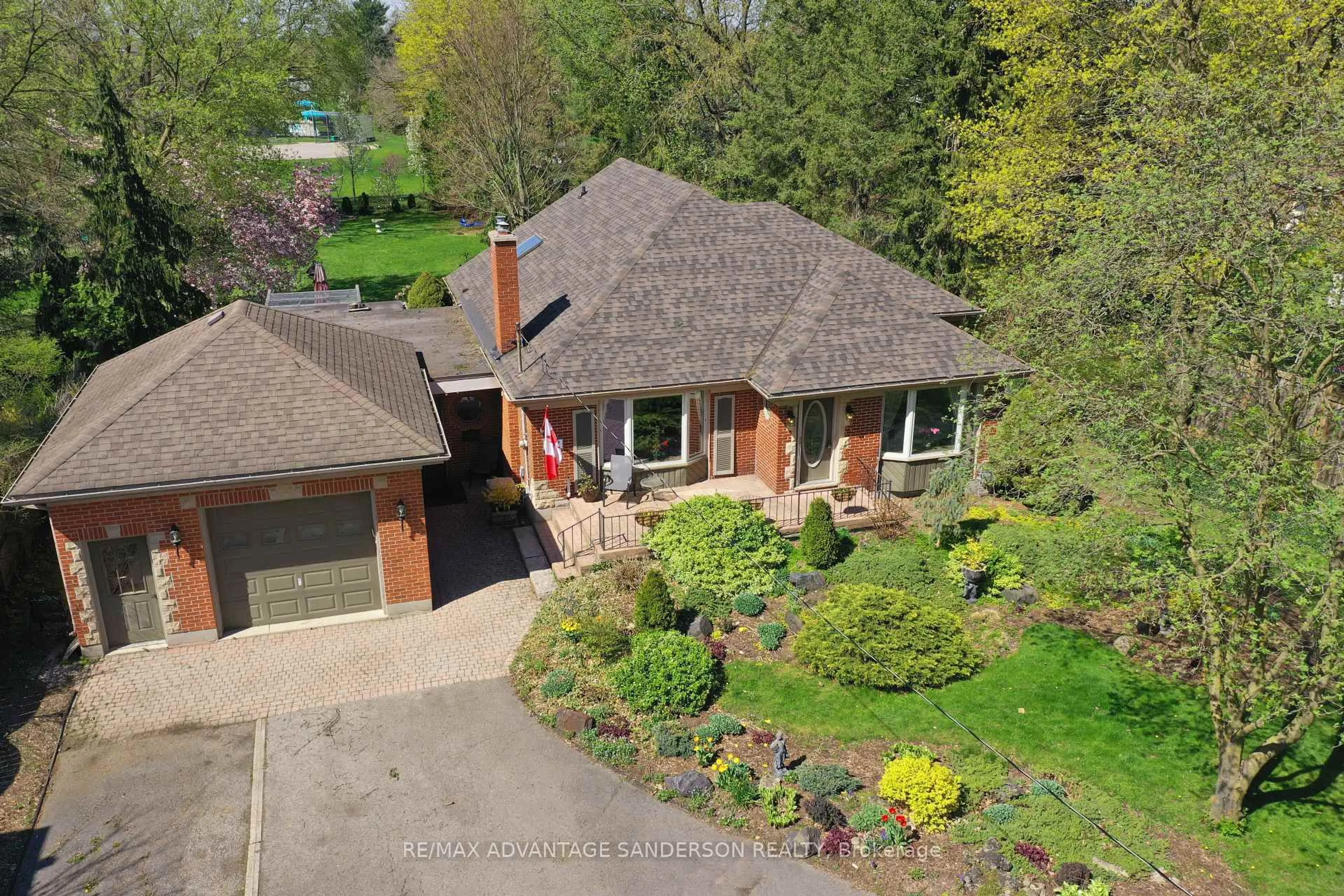 A pic from outside/outdoor area/front of a property/back of a property/a pic from drone, street for 1313 Byron Baseline Rd, London South Ontario N6K 2E4