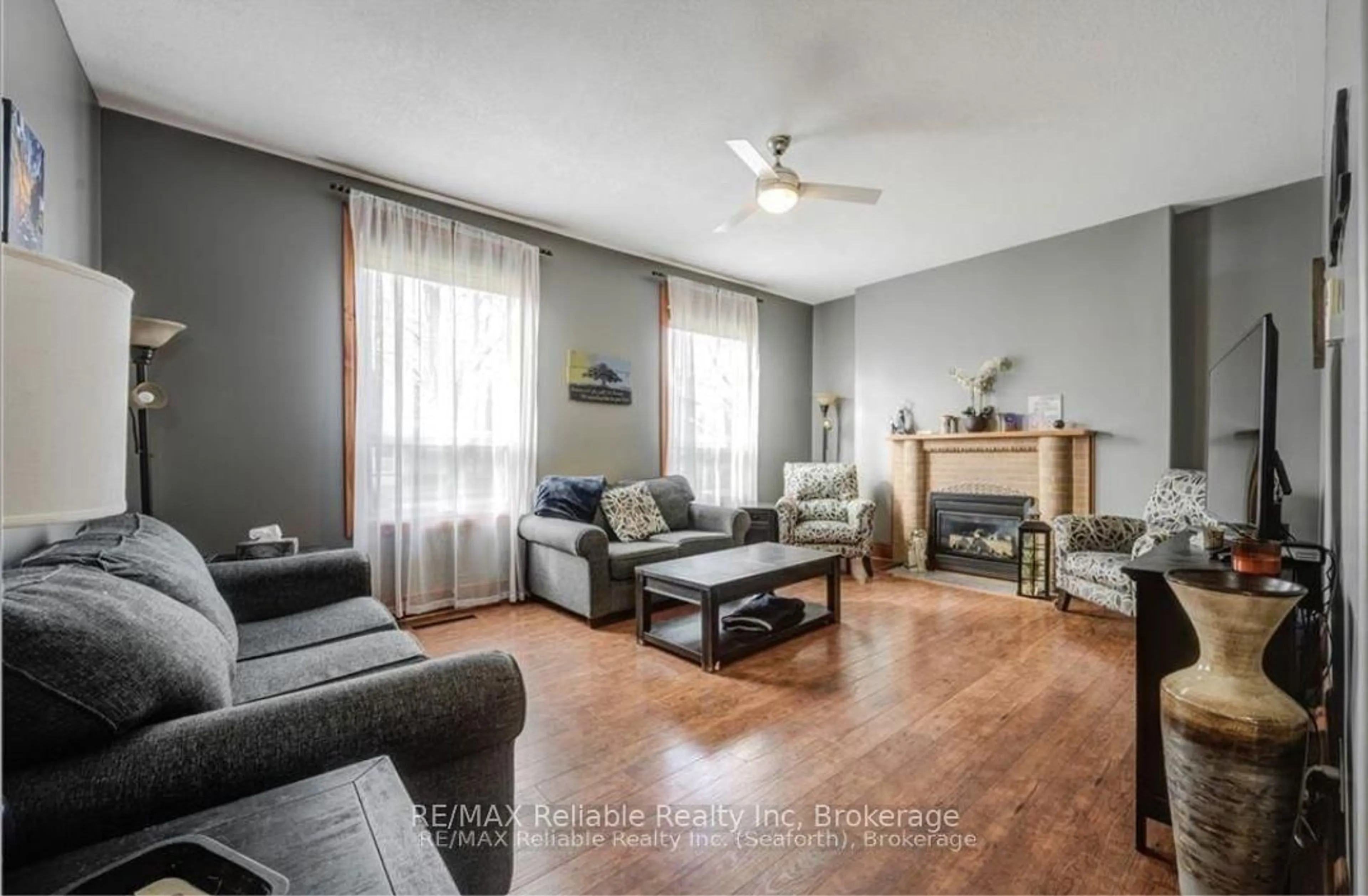 Living room with furniture, wood/laminate floor for 38 James St, Huron East Ontario N0K 1W0