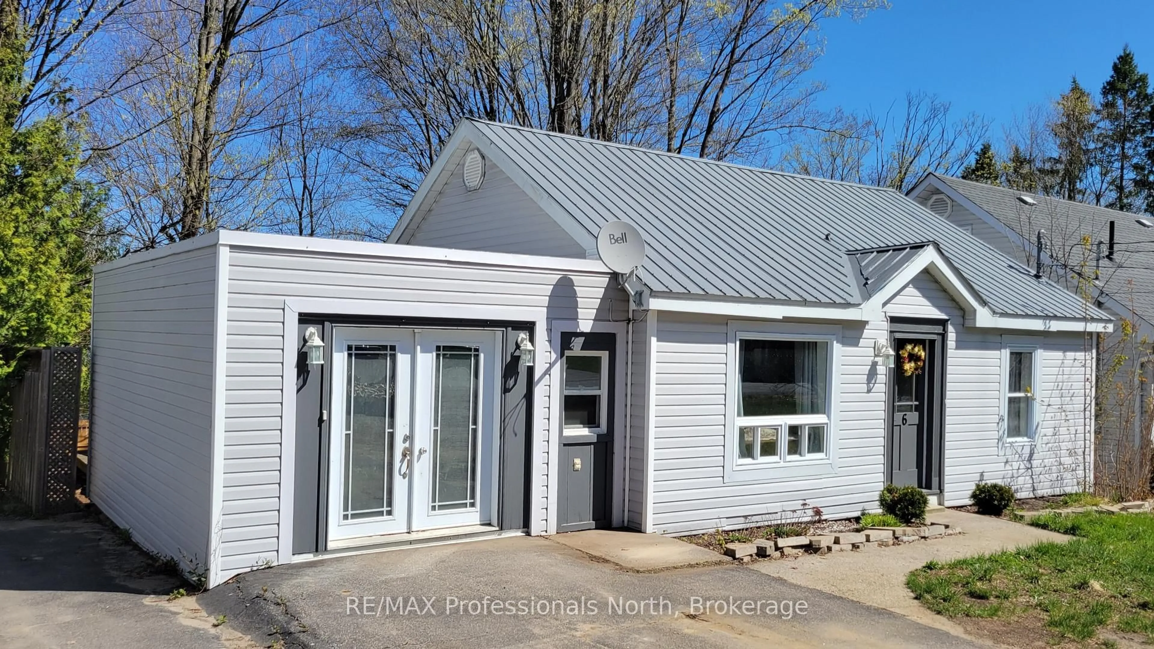 Home with vinyl exterior material, street for 6 Rogers Rd, Huntsville Ontario P1H 1T1