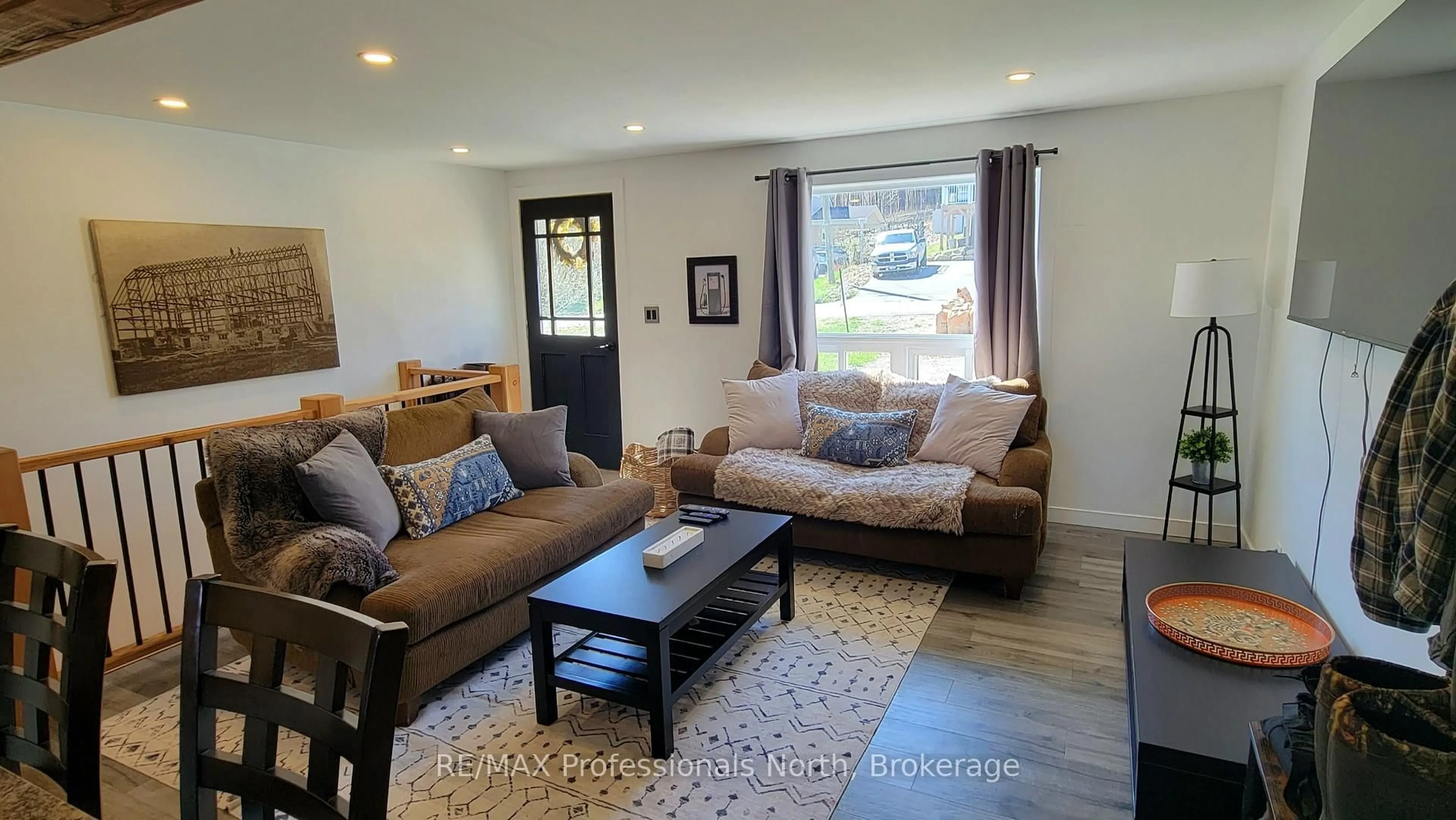 Living room with furniture, wood/laminate floor for 6 Rogers Rd, Huntsville Ontario P1H 1T1