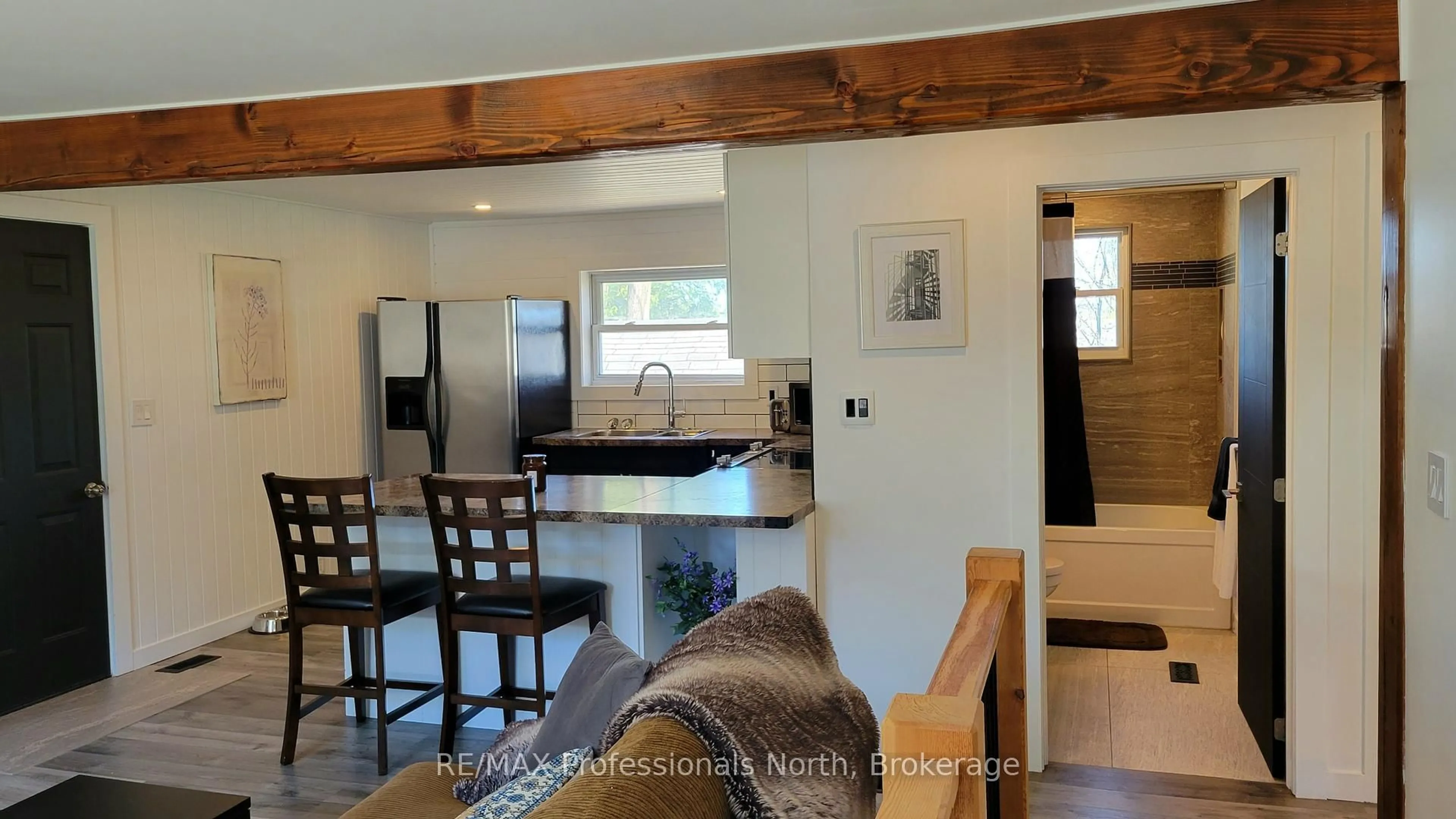 Open concept kitchen, wood/laminate floor for 6 Rogers Rd, Huntsville Ontario P1H 1T1