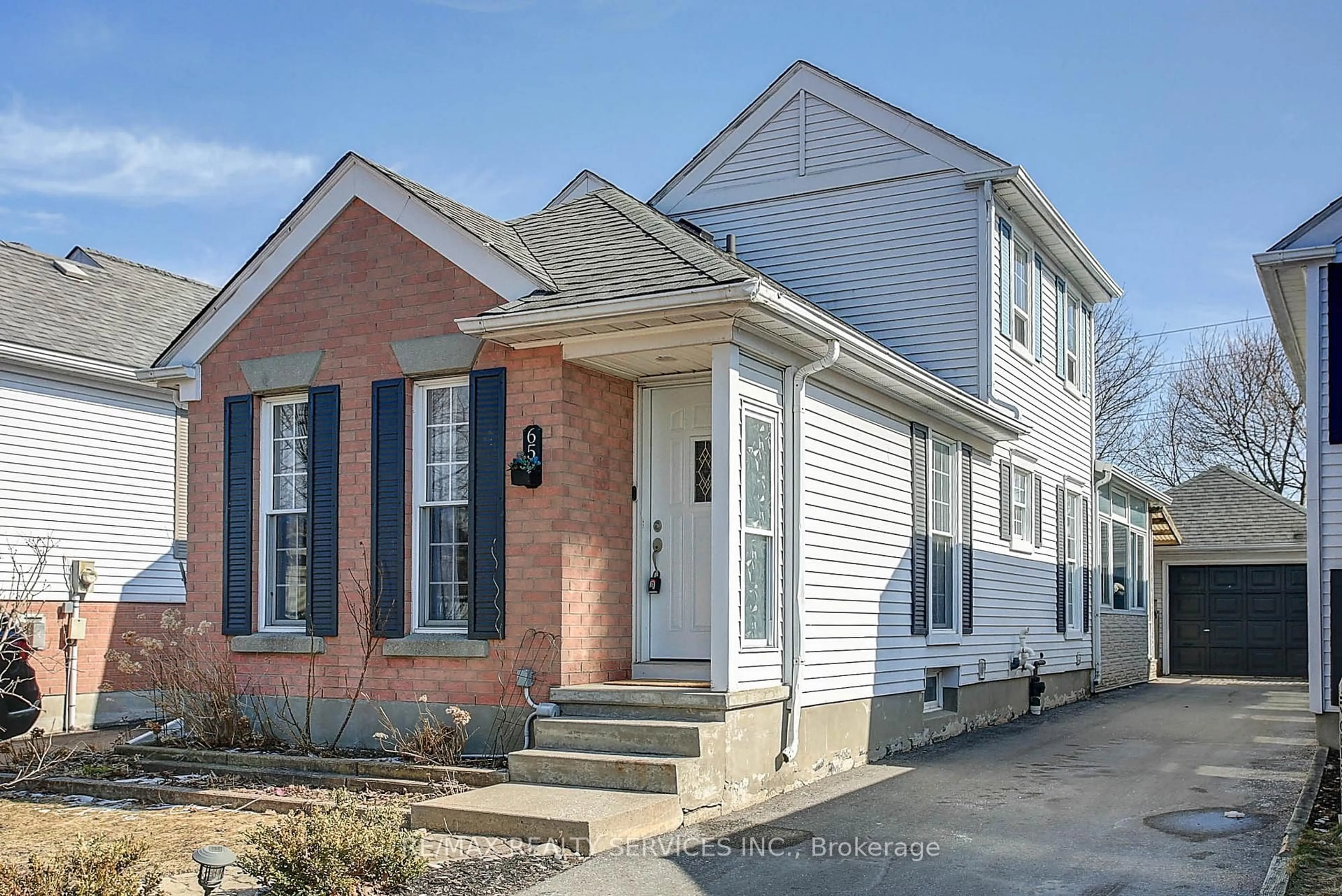 Home with brick exterior material, street for 65 Wake Robin Dr, Kitchener Ontario N2E 3L4
