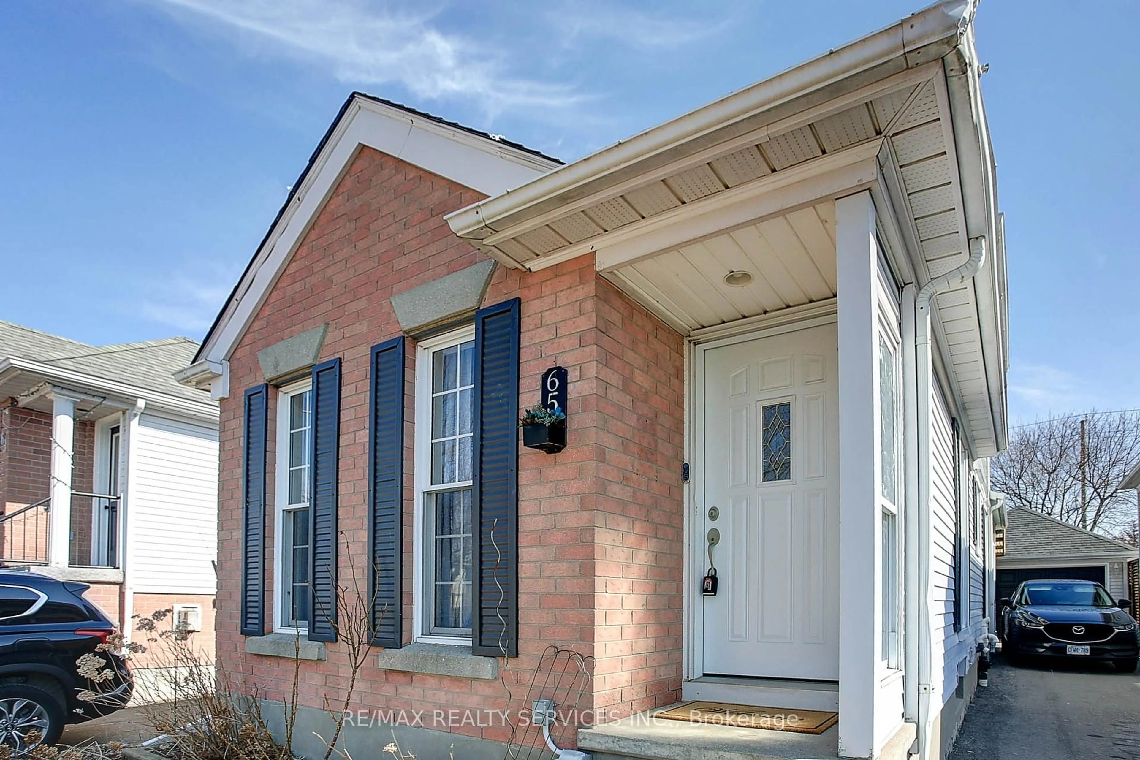 Home with brick exterior material, street for 65 Wake Robin Dr, Kitchener Ontario N2E 3L4