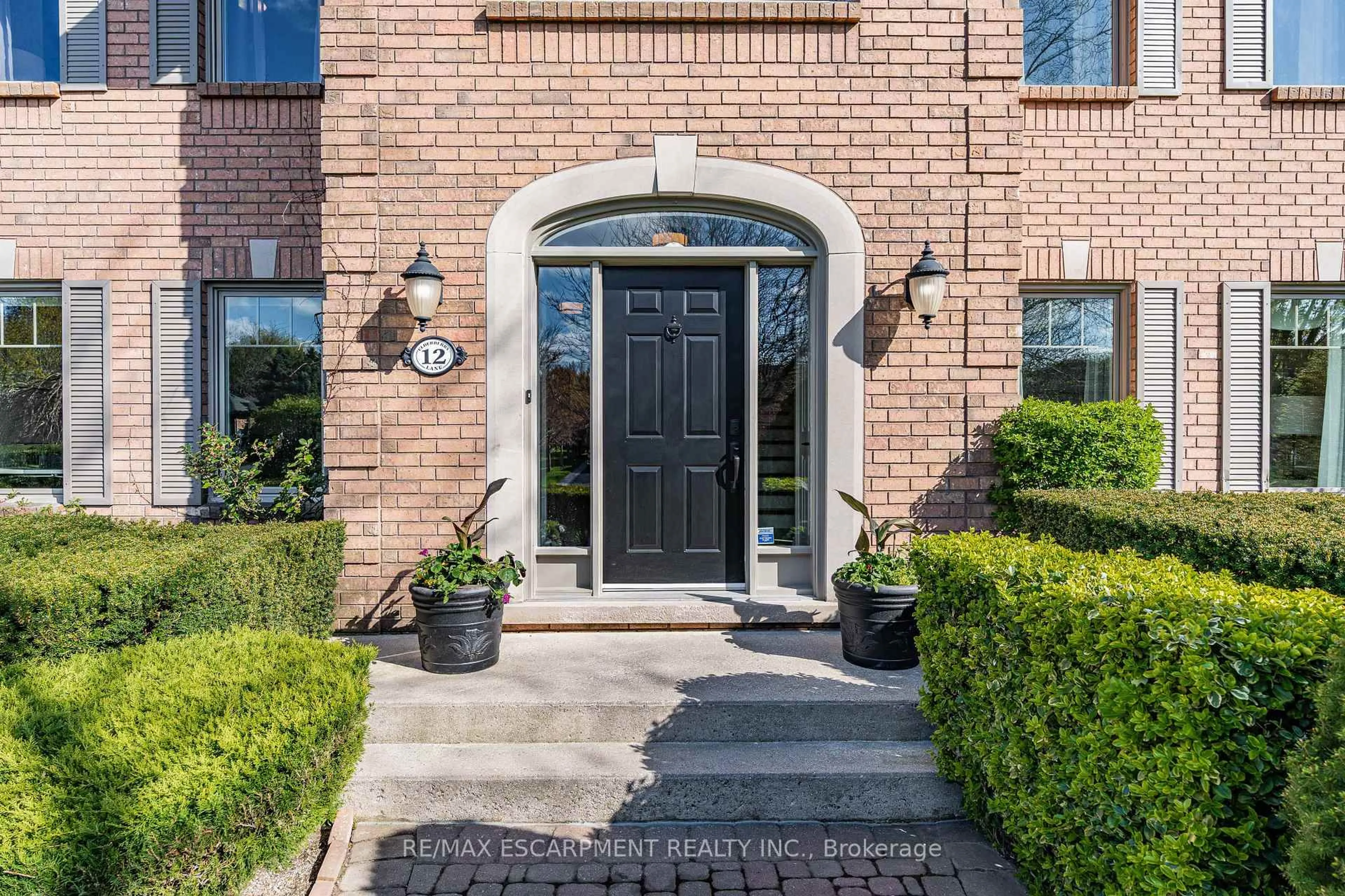 Home with brick exterior material, street for 12 Elderberry Lane, Hamilton Ontario L0R 1H2
