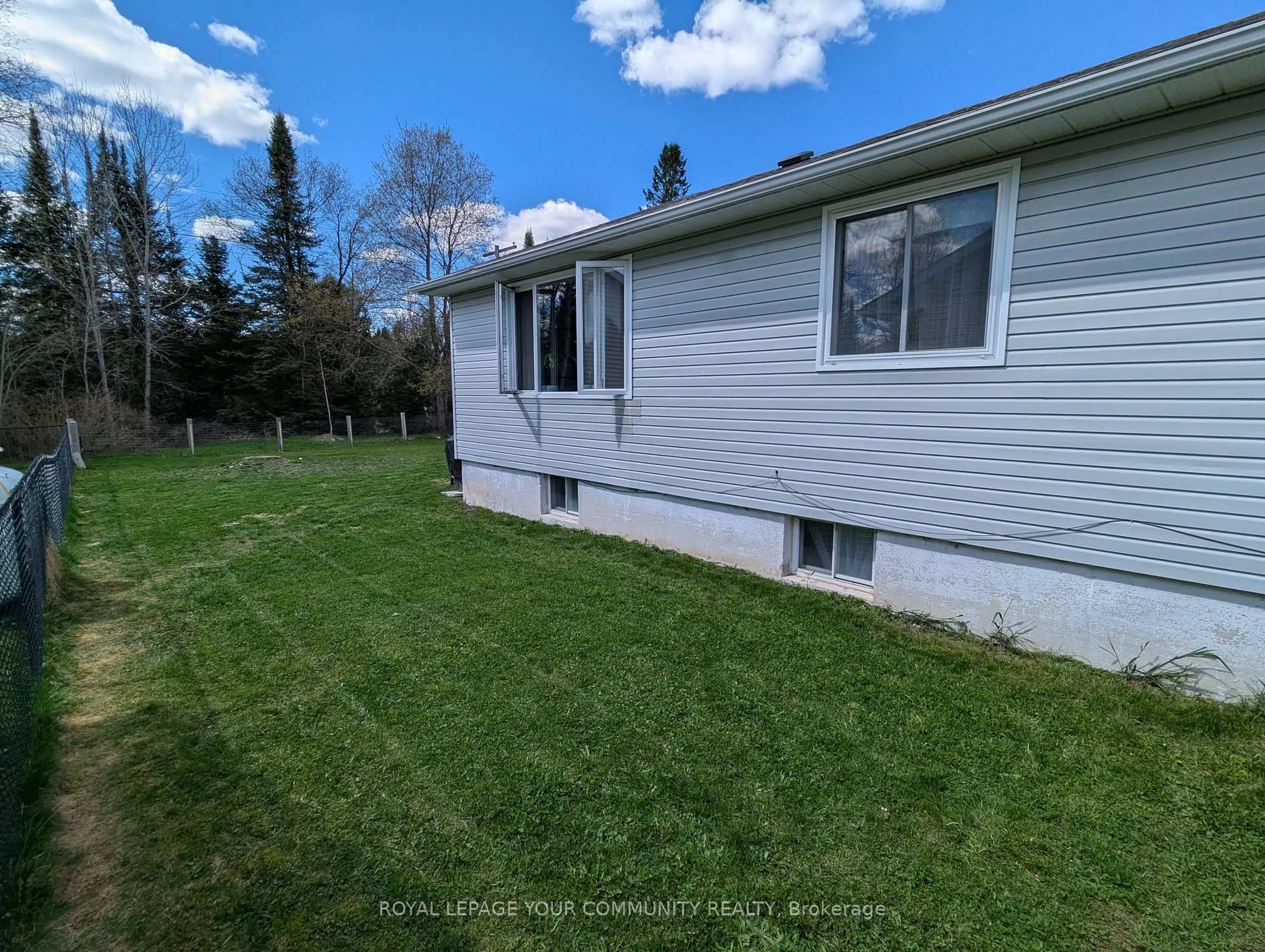 A pic from outside/outdoor area/front of a property/back of a property/a pic from drone, unknown for 42 Sprucedale St, Highlands East Ontario K0L 1M0