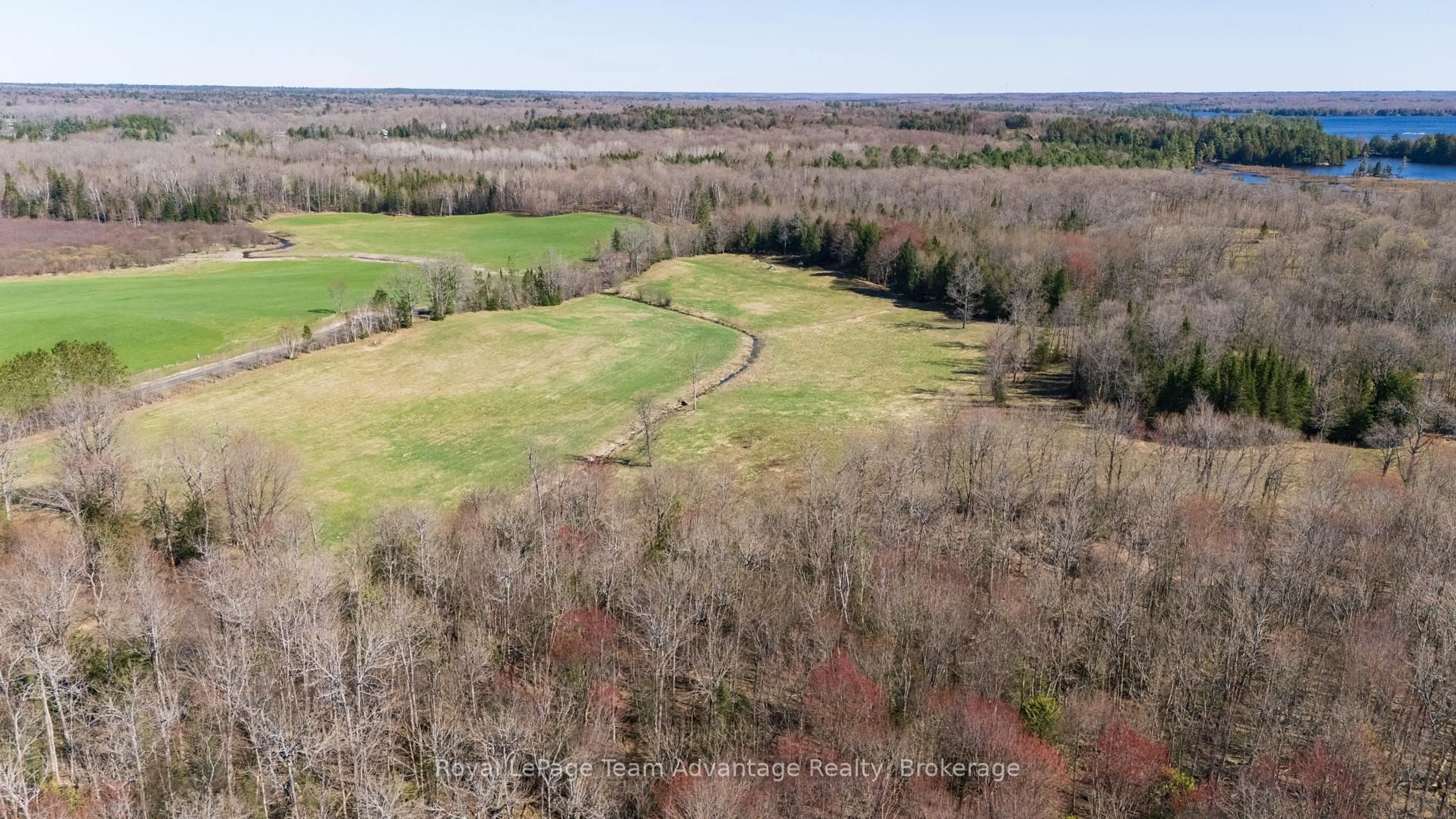 A pic from outside/outdoor area/front of a property/back of a property/a pic from drone, forest/trees view for 77 Lakeshore Rd, McKellar Ontario P0G 1C0
