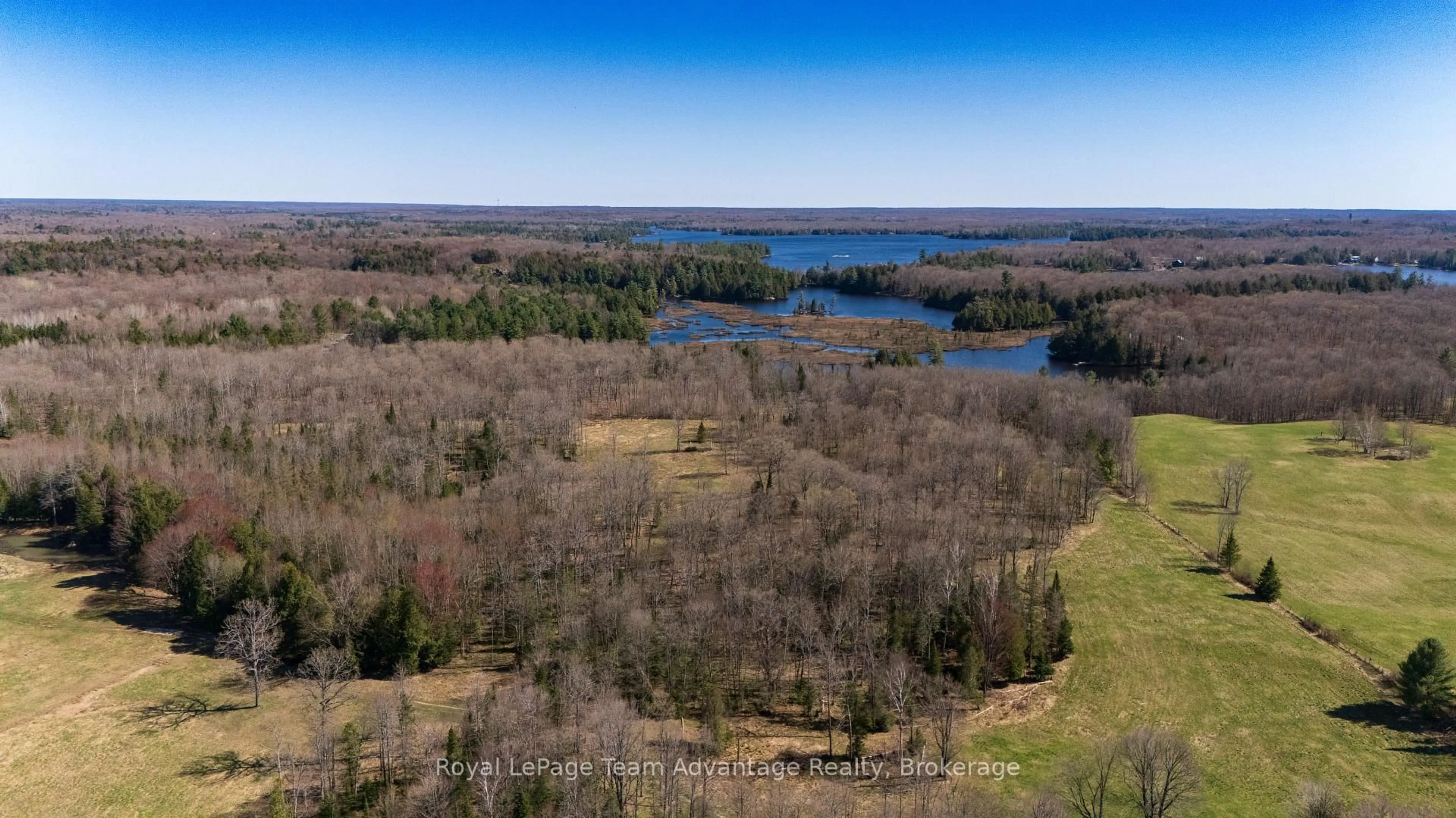 A pic from outside/outdoor area/front of a property/back of a property/a pic from drone, water/lake/river/ocean view for 77 Lakeshore Rd, McKellar Ontario P0G 1C0