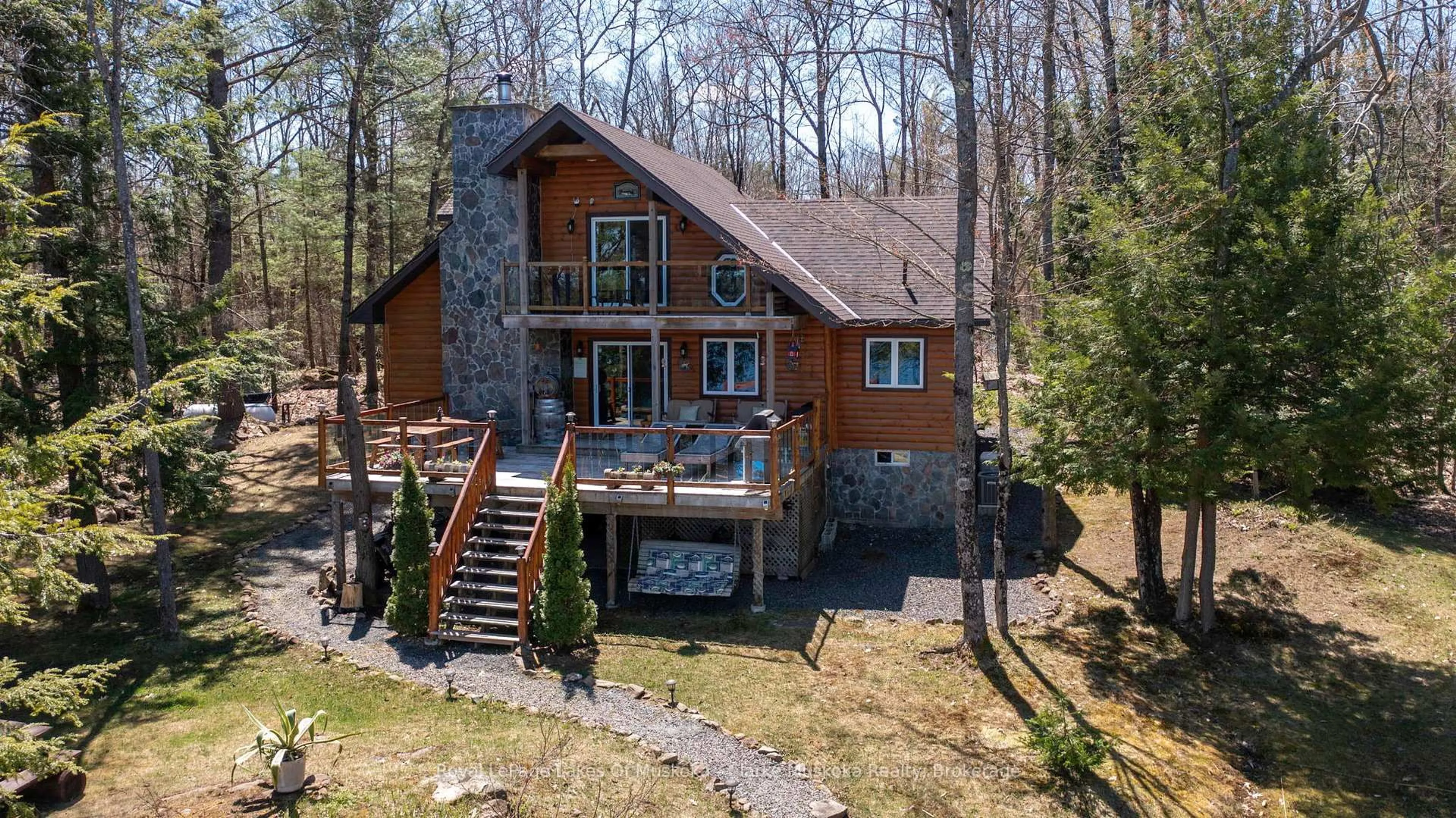 A pic from outside/outdoor area/front of a property/back of a property/a pic from drone, water/lake/river/ocean view for 1041 Summit Rd #1, Muskoka Lakes Ontario P0C 1M0