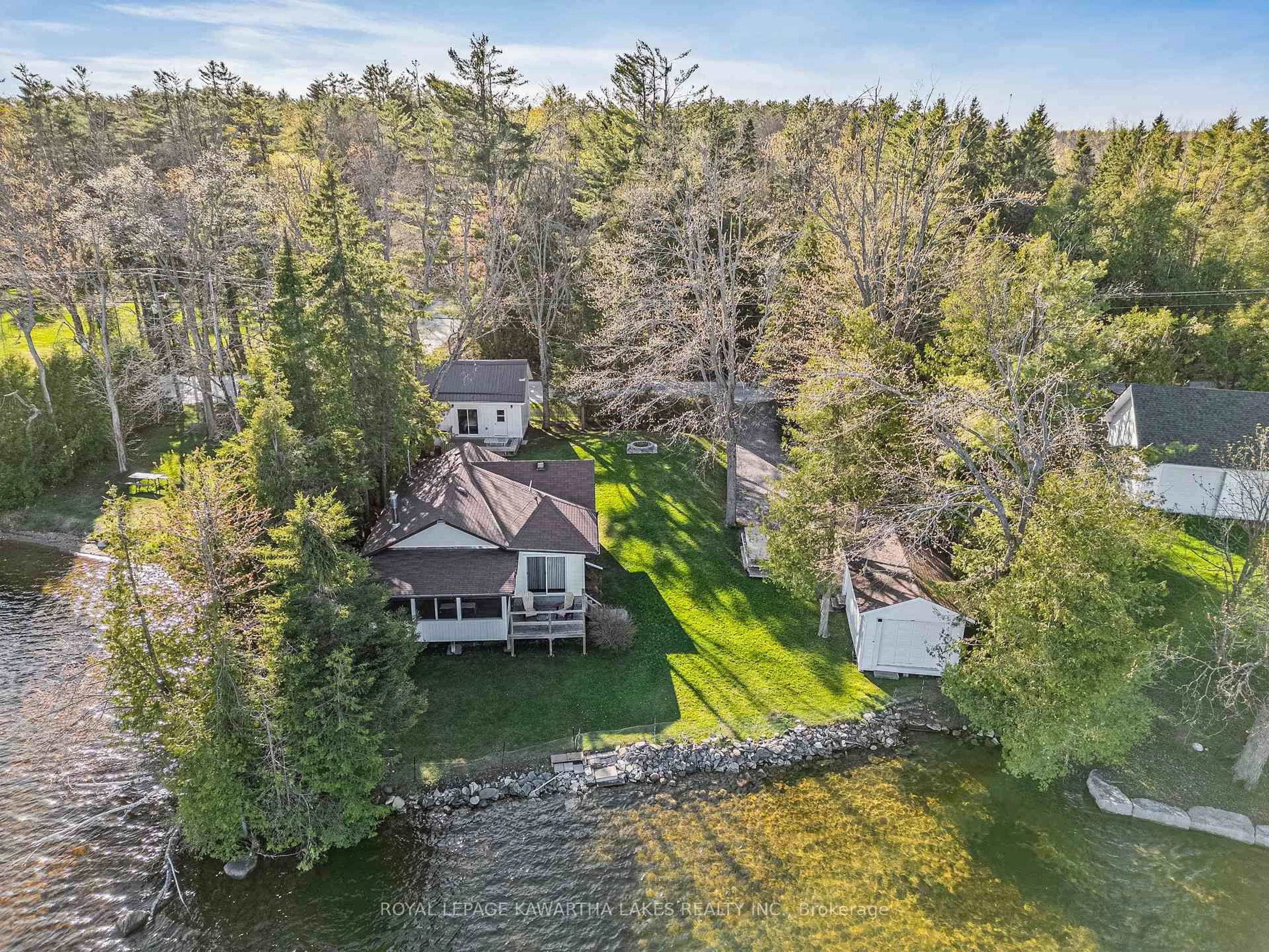 A pic from outside/outdoor area/front of a property/back of a property/a pic from drone, water/lake/river/ocean view for 404 Balsam Lake Dr, Kawartha Lakes Ontario K0M 2B0