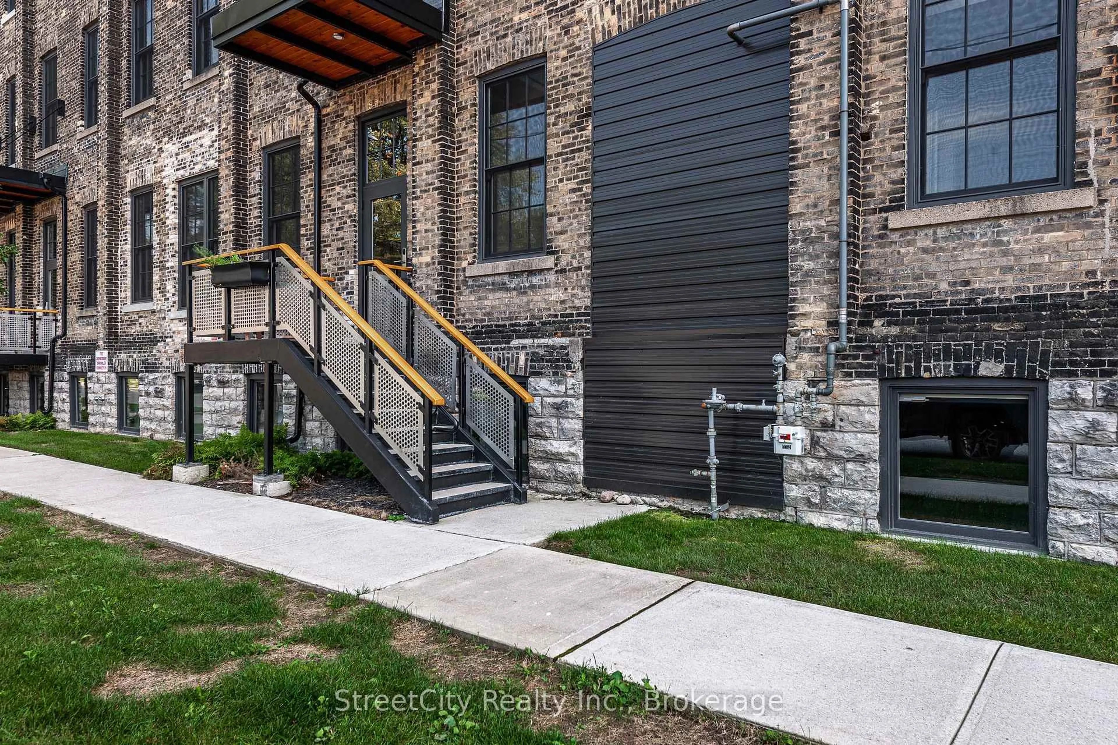 Home with brick exterior material, street for 245 Downie St #104, Stratford Ontario N5A 1X5