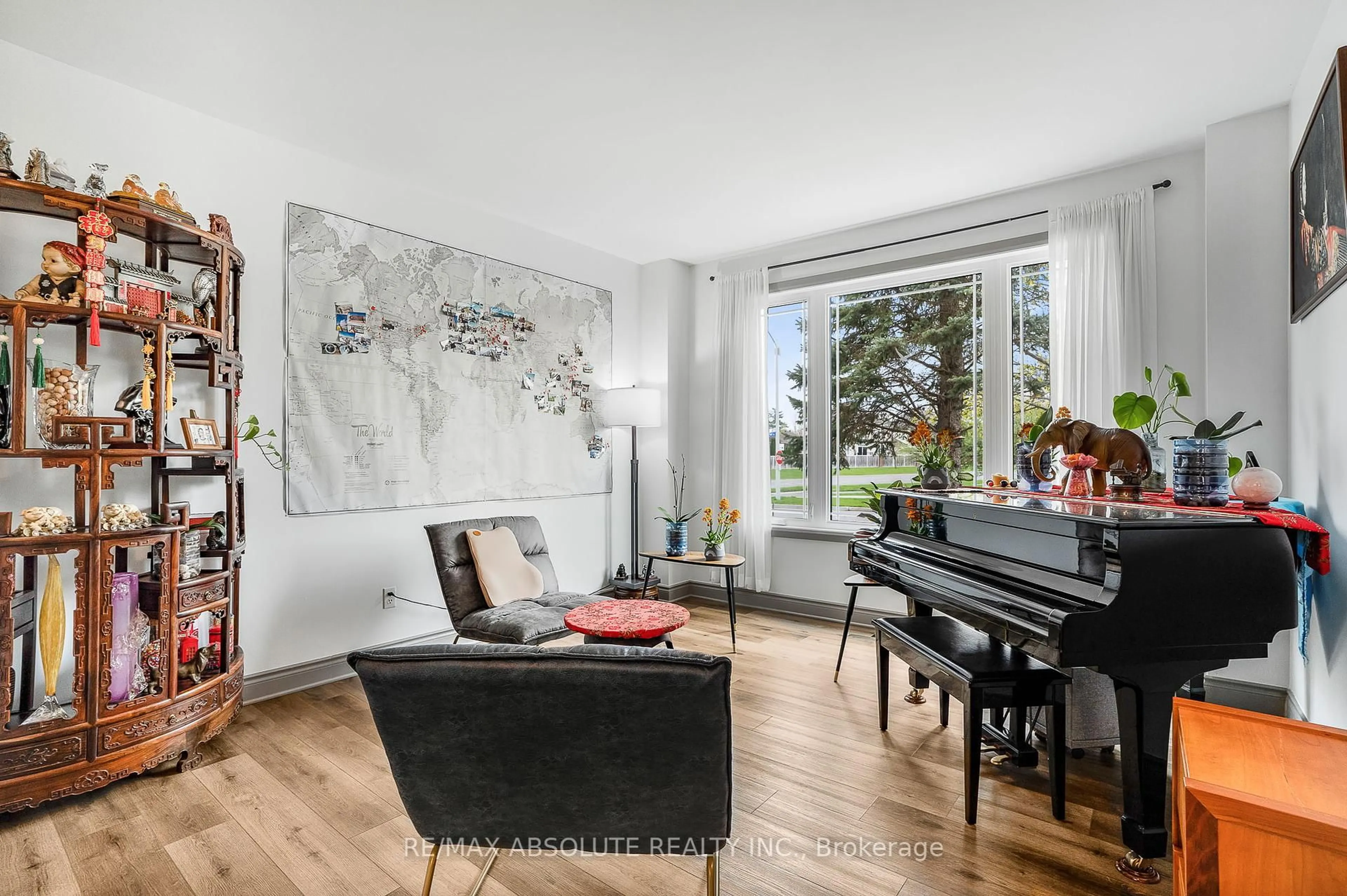 Living room with furniture, wood/laminate floor for 6000 Longleaf Dr, Orleans Ontario K1W 1J2