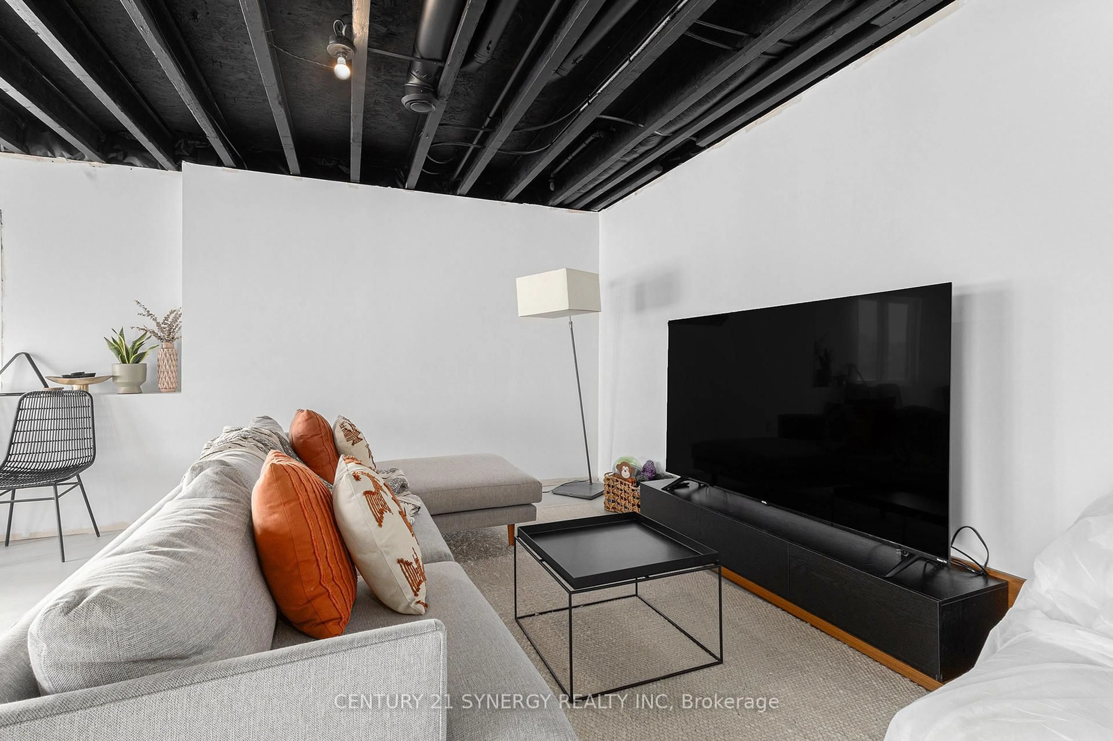 Living room with furniture, cement floor for 737 Walton St, Cornwall Ontario K6H 0J2