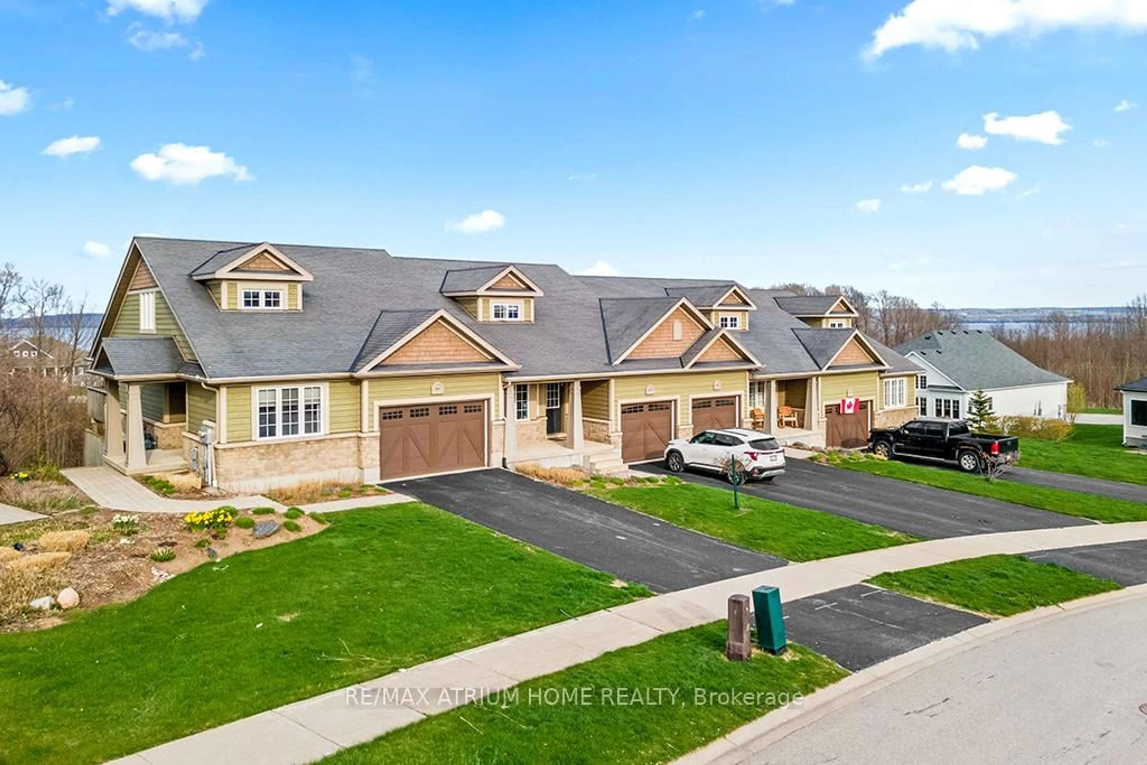 A pic from outside/outdoor area/front of a property/back of a property/a pic from drone, street for 307 Telford Tr #4, Georgian Bluffs Ontario N0H 1S0