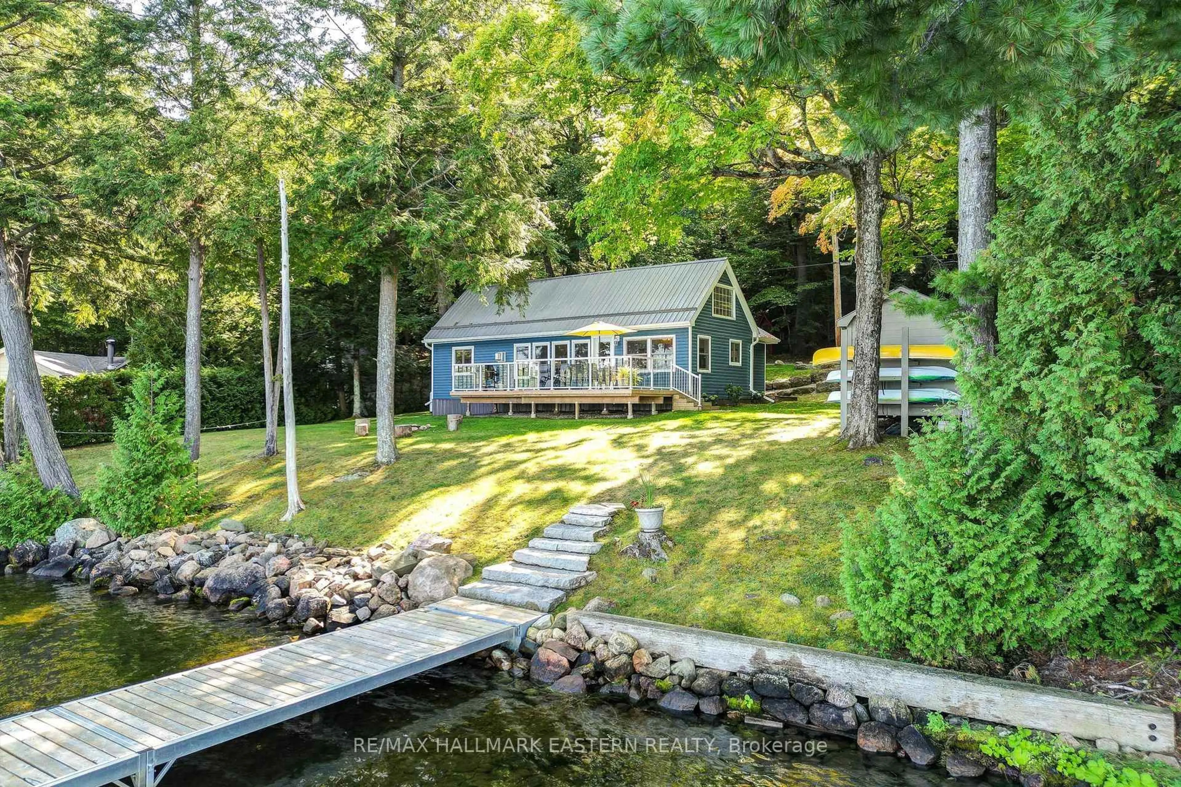 A pic from outside/outdoor area/front of a property/back of a property/a pic from drone, water/lake/river/ocean view for 3158 Spring Lane, Selwyn Ontario K0L 2H0