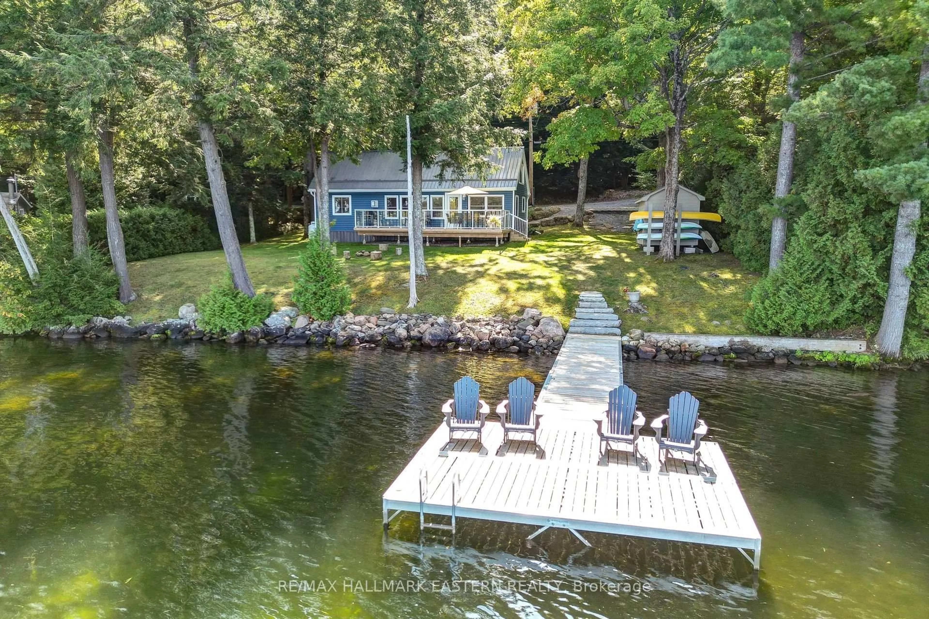 A pic from outside/outdoor area/front of a property/back of a property/a pic from drone, water/lake/river/ocean view for 3158 Spring Lane, Selwyn Ontario K0L 2H0