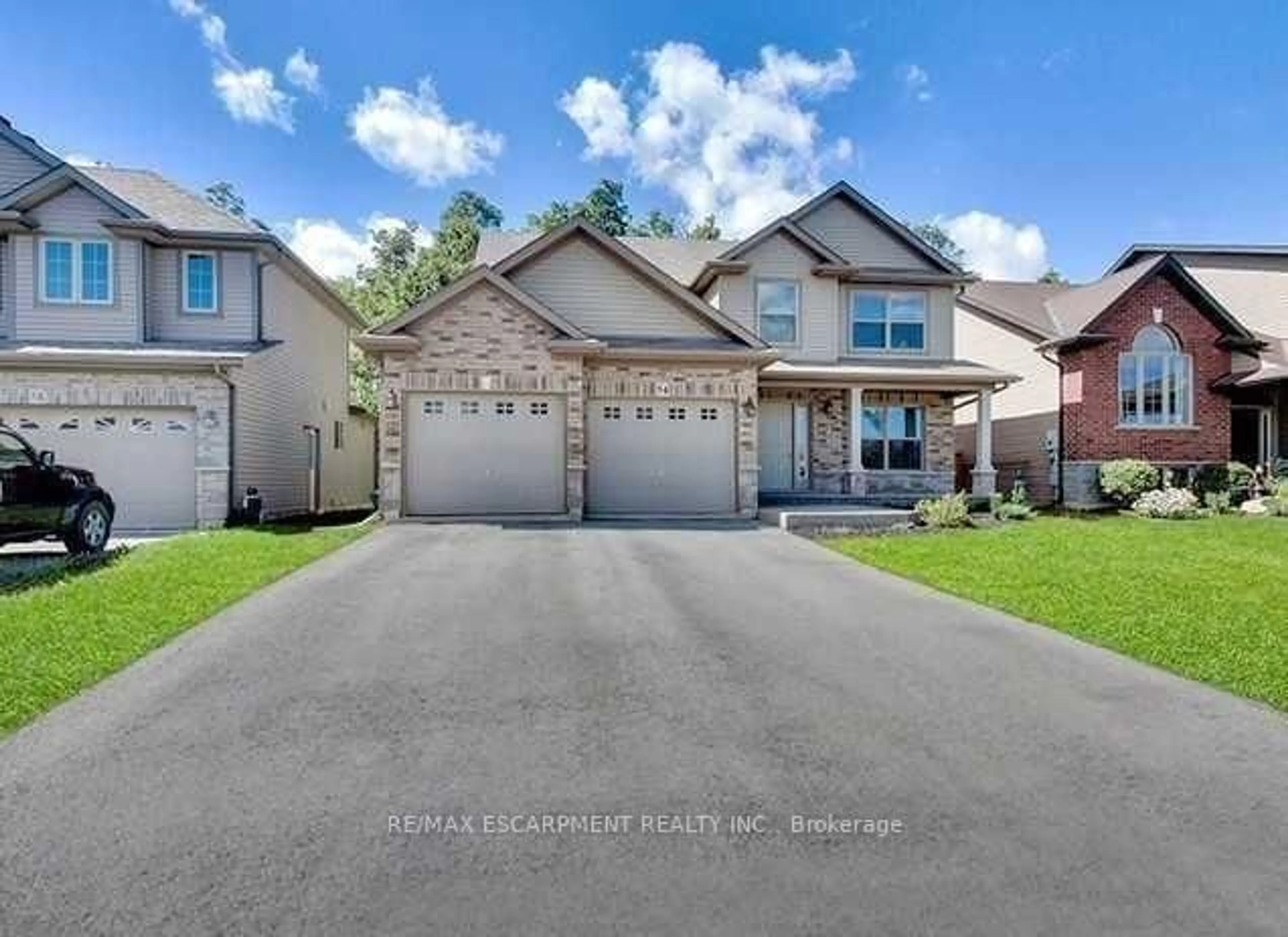 Home with brick exterior material, street for 54 Harvest Gate, West Lincoln Ontario L0R 2A0