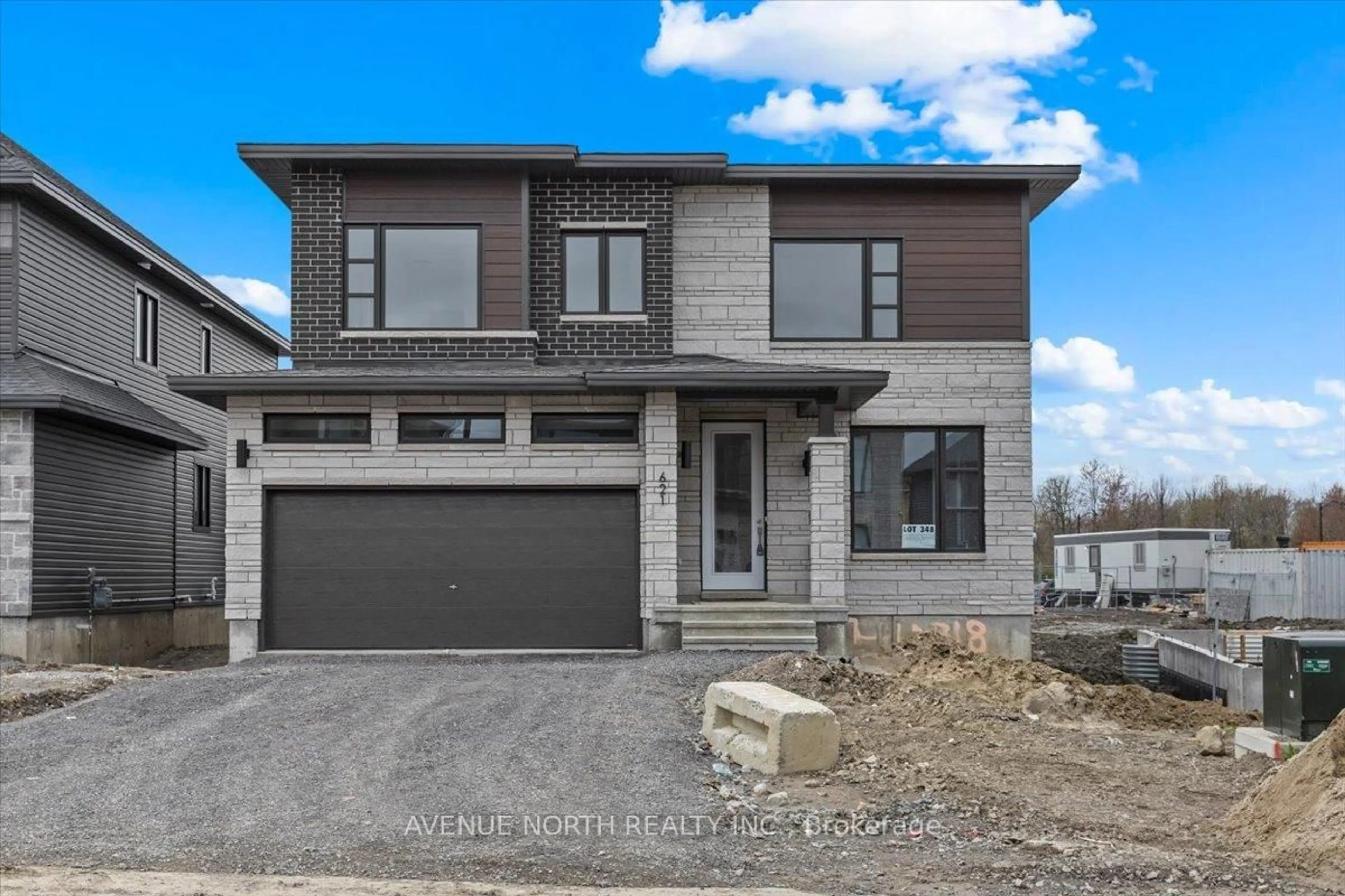 Home with brick exterior material, street for 621 MIIKANA Rd, Ottawa Ontario K1X 0G6