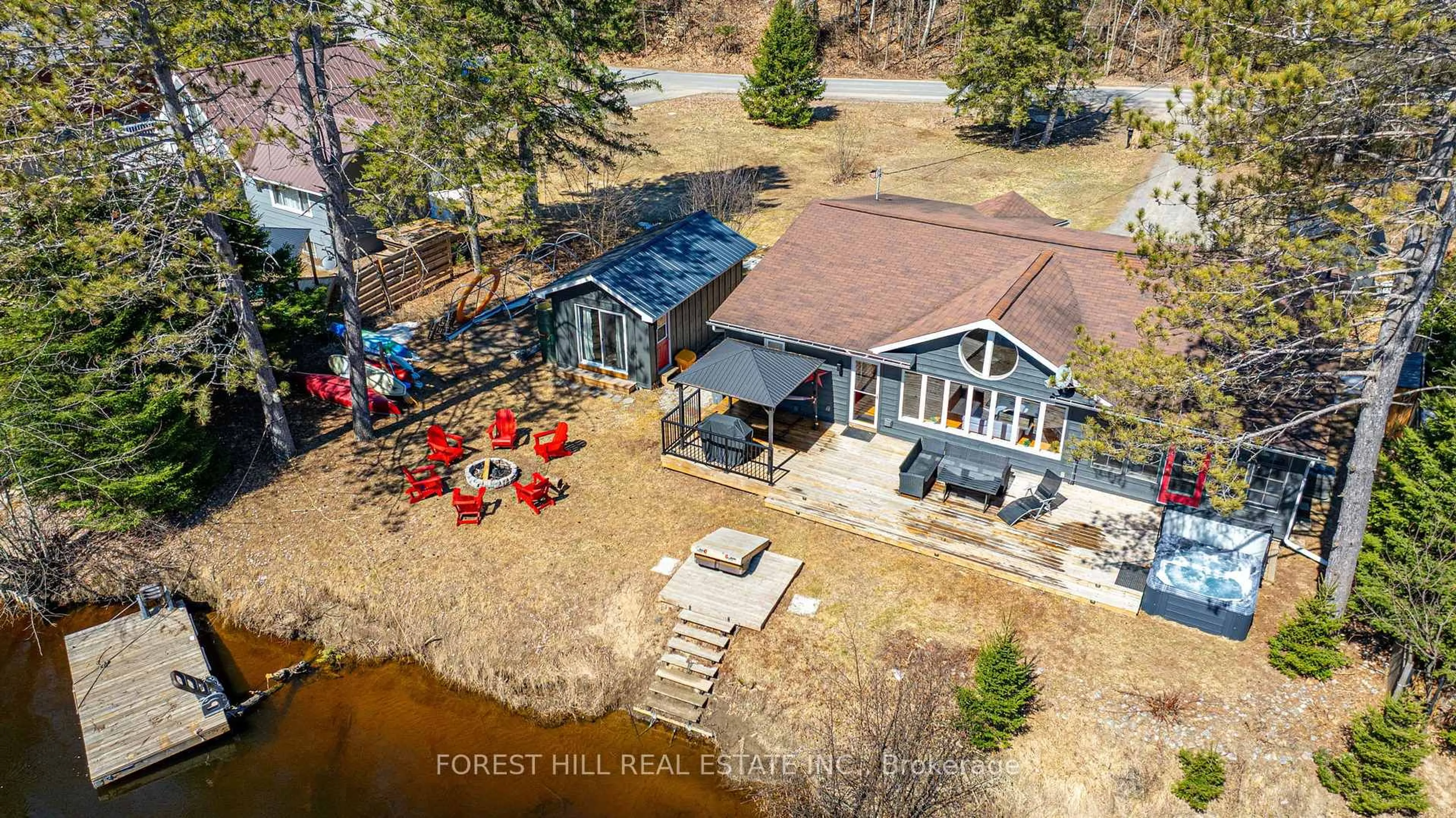 A pic from outside/outdoor area/front of a property/back of a property/a pic from drone, forest/trees view for 31 GLEN ACRES Rd, Huntsville Ontario P1H 1N6