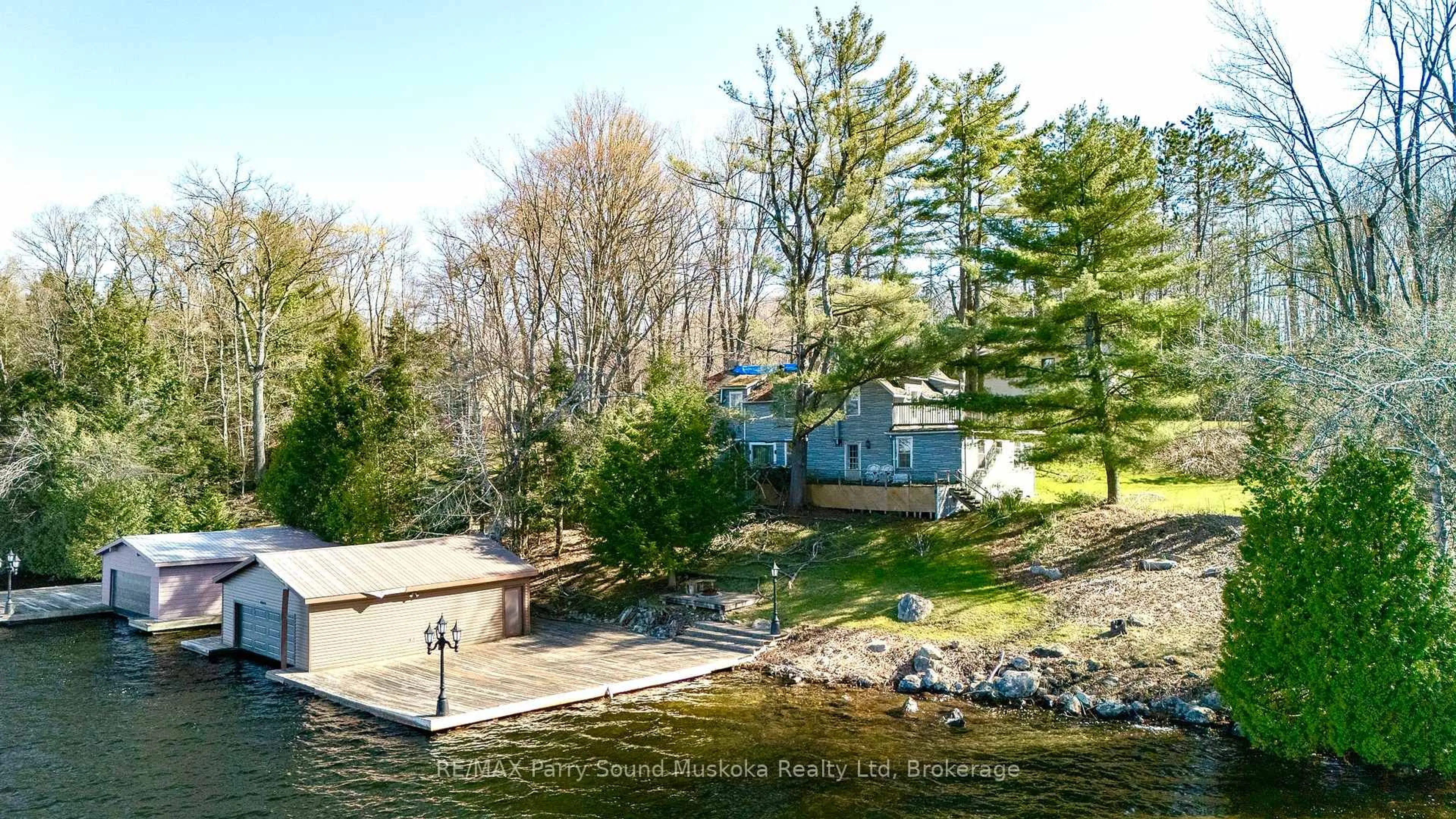 A pic from outside/outdoor area/front of a property/back of a property/a pic from drone, water/lake/river/ocean view for 1932A Lake Joseph Rd, Seguin Ontario P0C 1H0