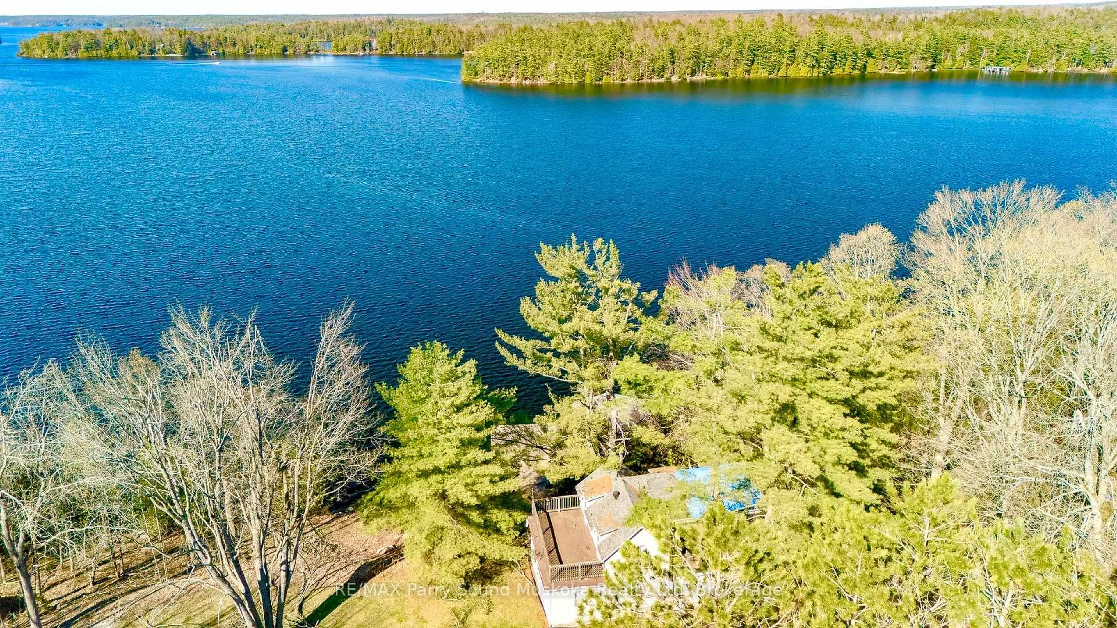 A pic from outside/outdoor area/front of a property/back of a property/a pic from drone, water/lake/river/ocean view for 1932A Lake Joseph Rd, Seguin Ontario P0C 1H0