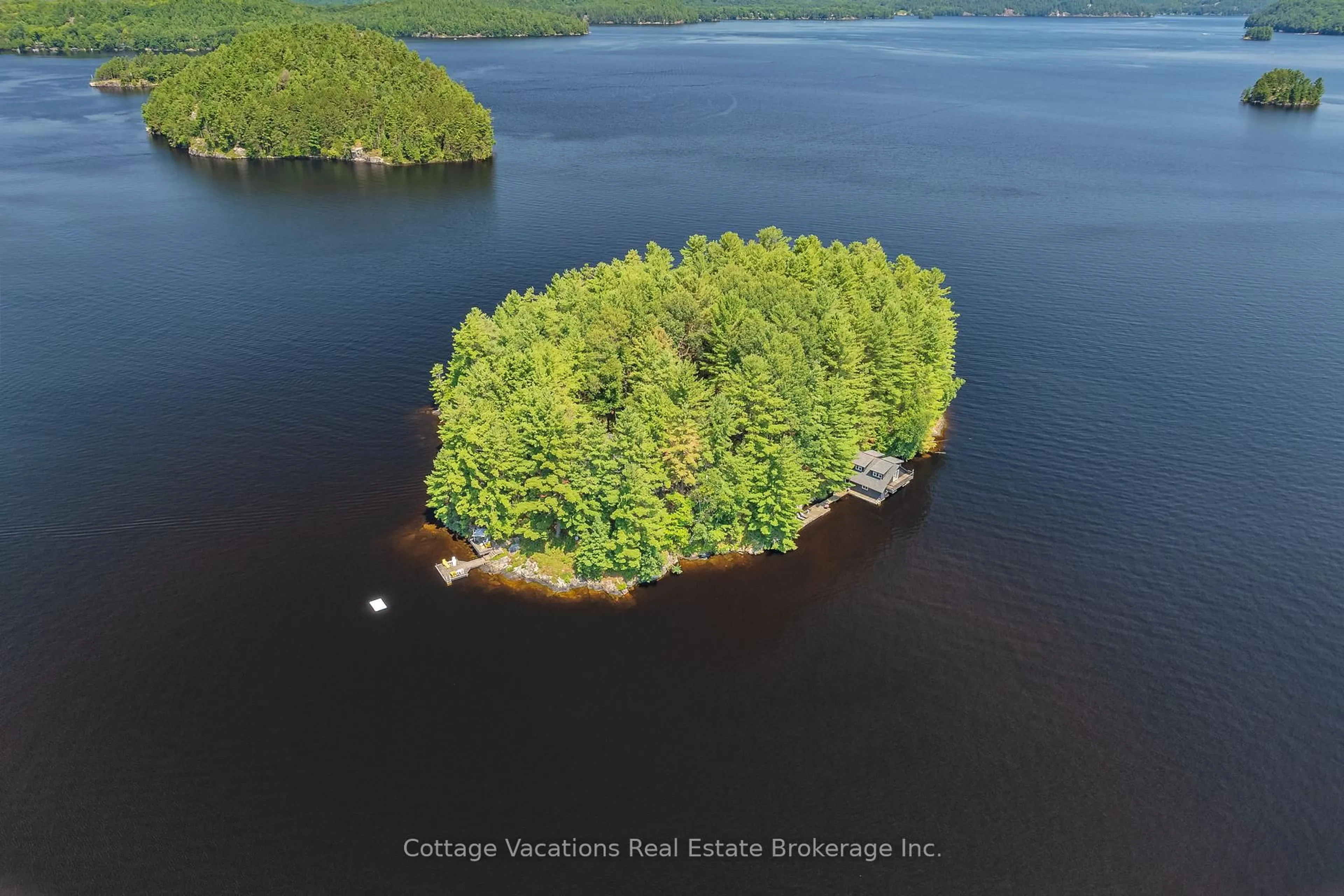 A pic from outside/outdoor area/front of a property/back of a property/a pic from drone, water/lake/river/ocean view for 100 RUMBALLS N/A, Huntsville Ontario P0B 1L0